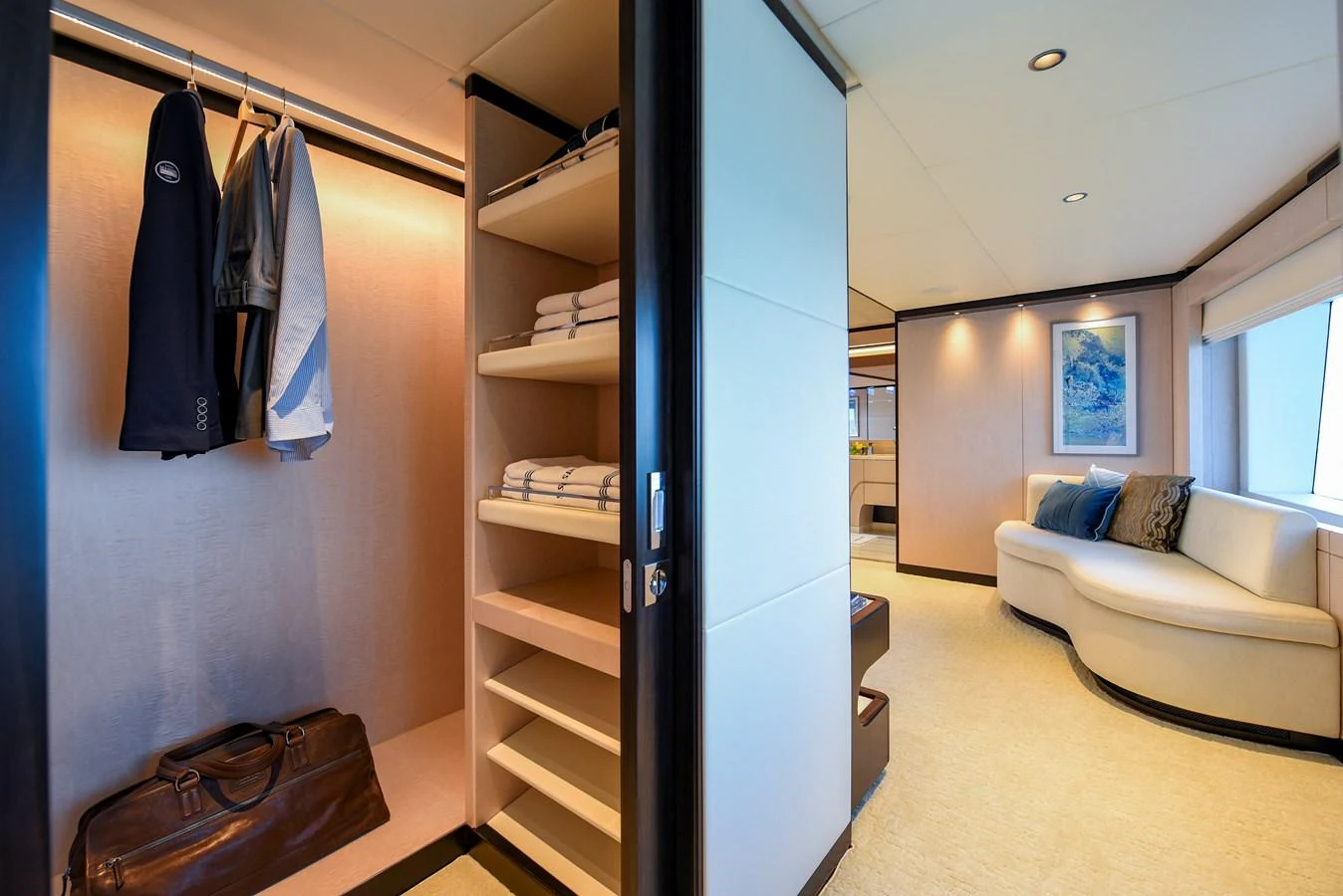 a room with a bed and a closet aboard MAJESTY 120 Yacht for Sale