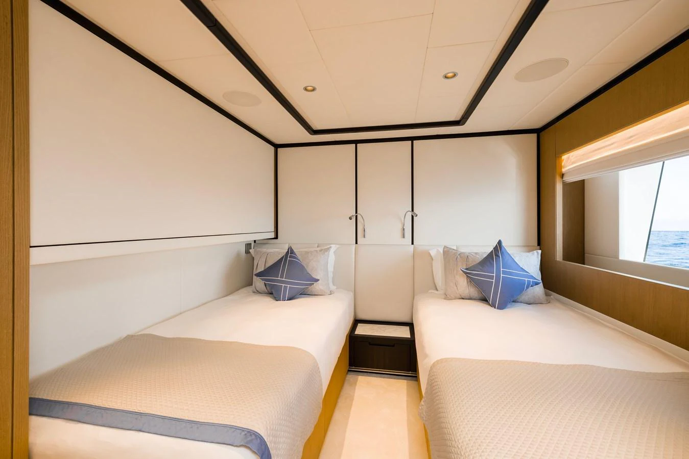 a room with two beds aboard MAJESTY 120 Yacht for Sale
