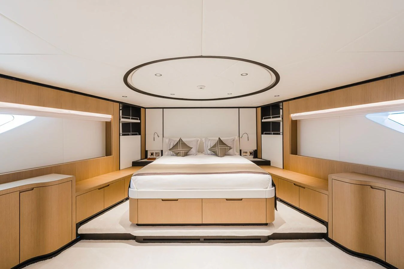 a room with a bed and a round mirror aboard MAJESTY 120 Yacht for Sale