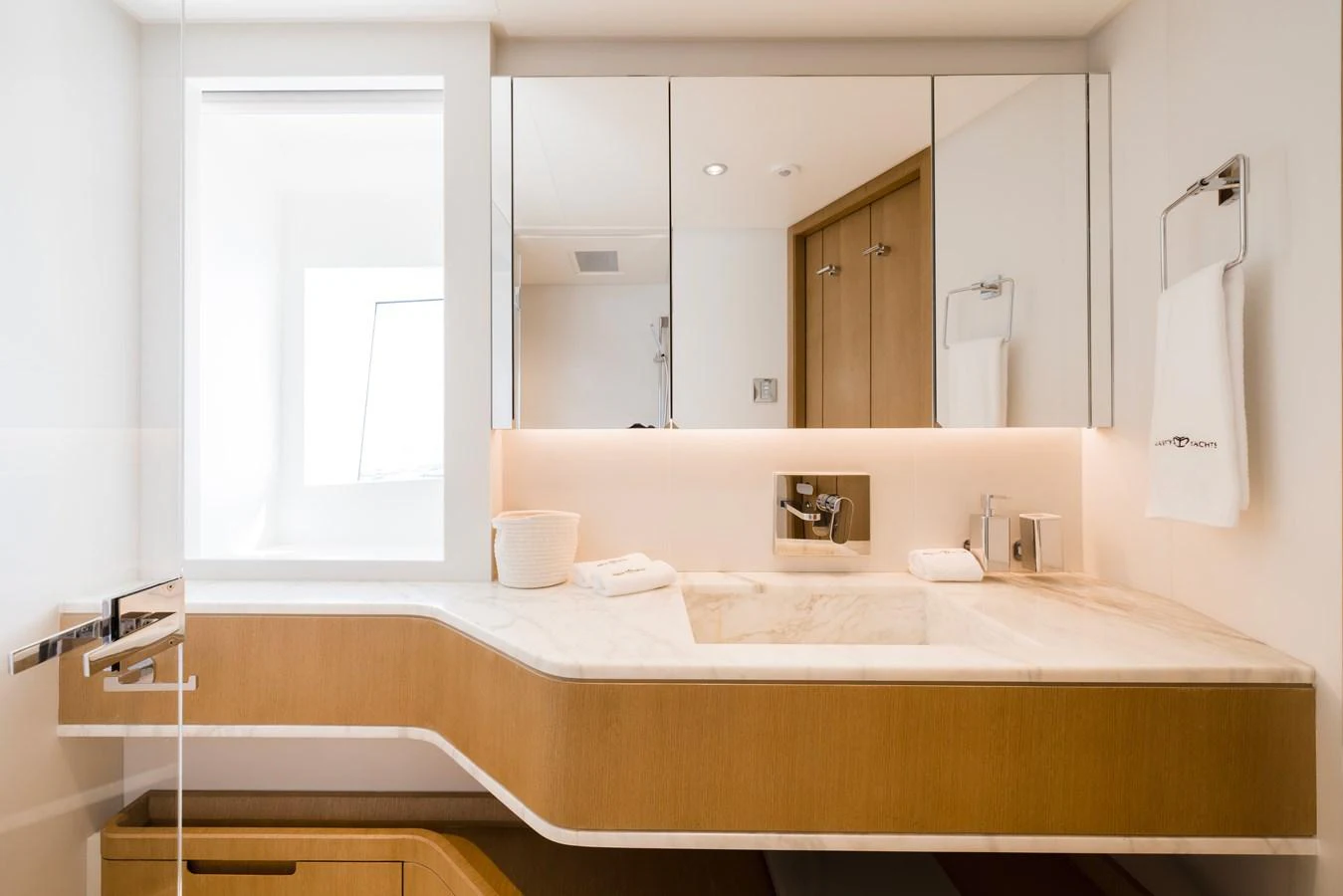 a bathroom with a large mirror aboard MAJESTY 120 Yacht for Sale