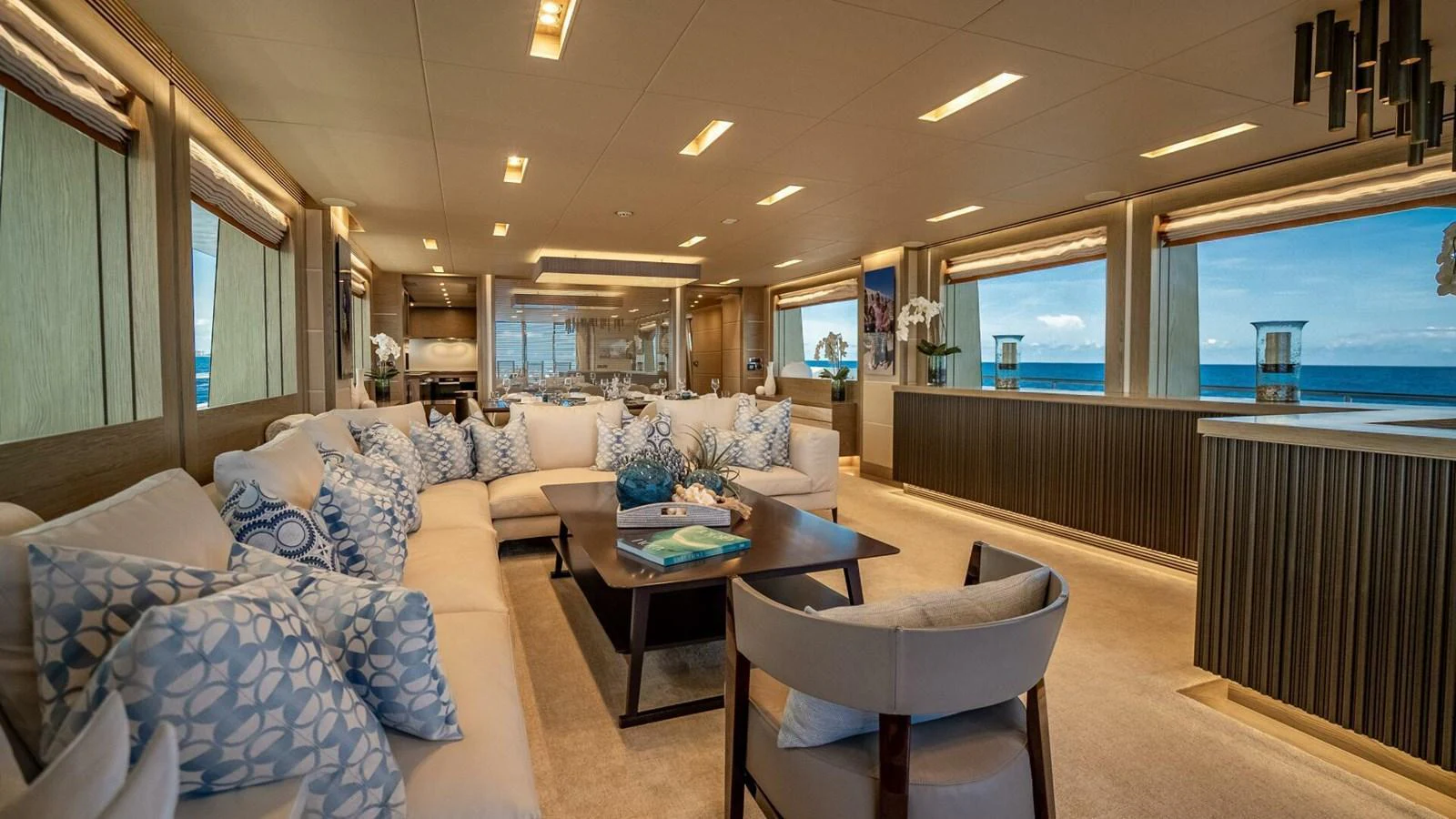 The yacht's salon offers a spacious and elegant seating area with panoramic ocean views. aboard SHORT STORY Yacht for Sale