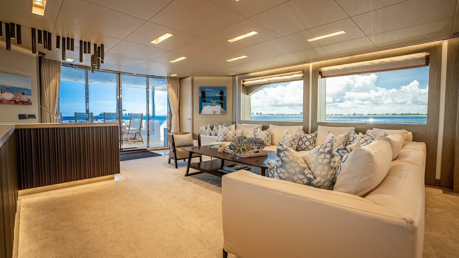 The salon offers a spacious and luxurious seating area with panoramic ocean views. aboard SHORT STORY Yacht for Sale