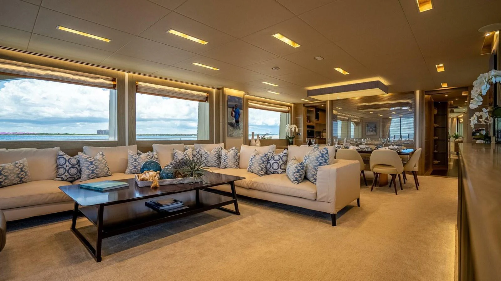 The spacious salon features plush seating and large windows offering panoramic views. aboard SHORT STORY Yacht for Sale
