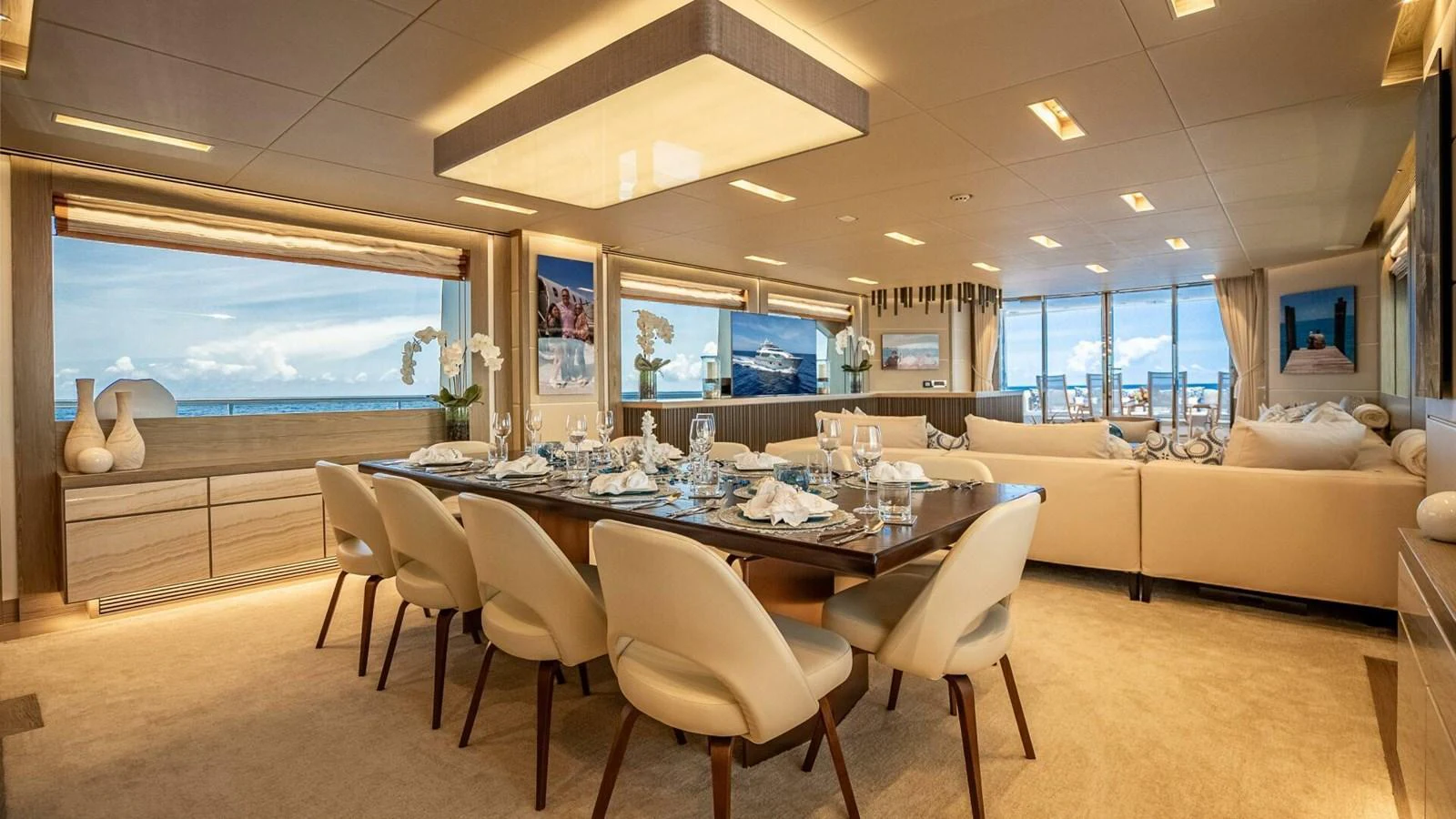 The yacht's dining area features elegant seating and panoramic ocean views. aboard SHORT STORY Yacht for Sale