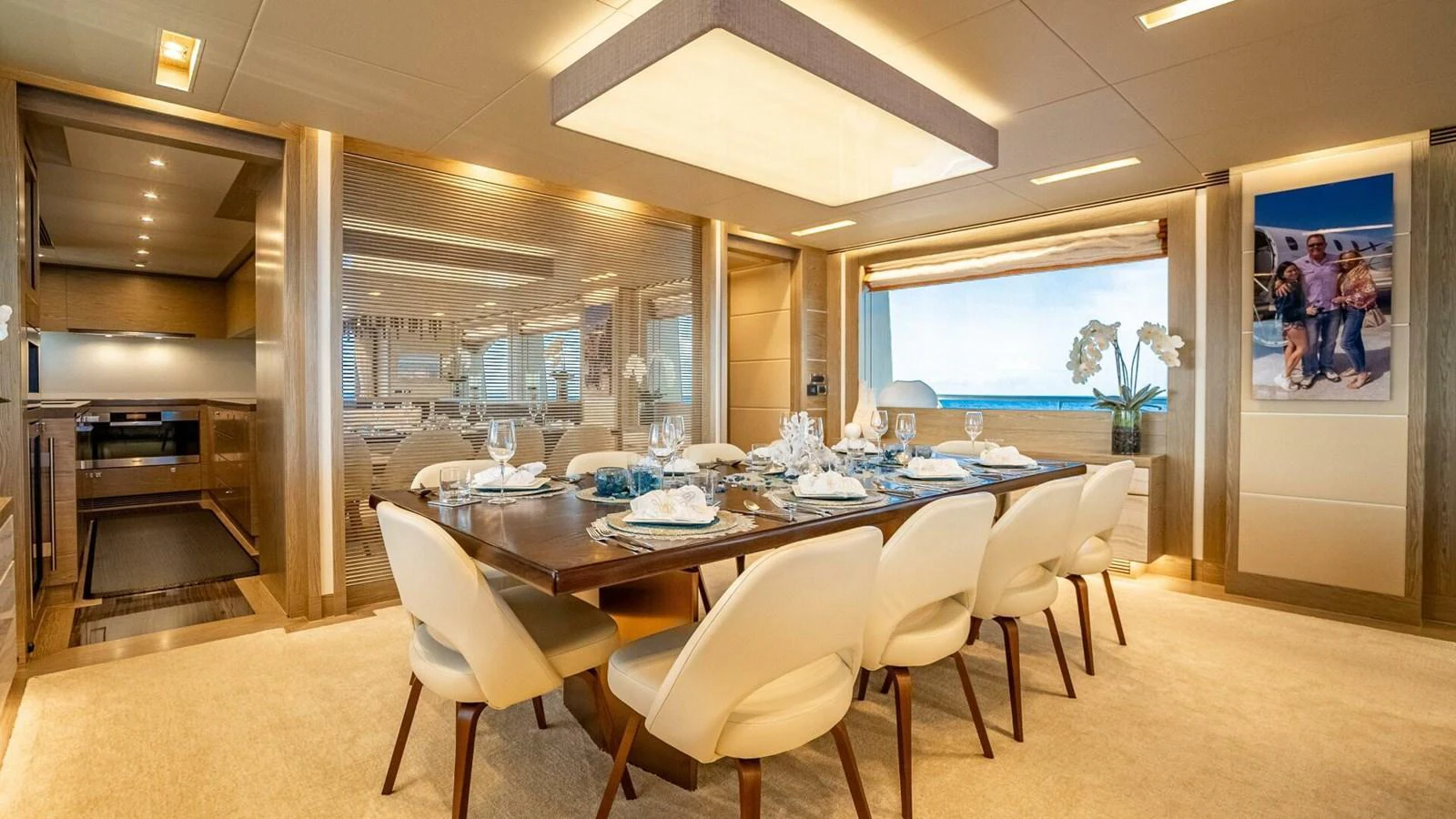 The yacht's dining area features a luxurious table setting with elegant decor and ample seating. aboard SHORT STORY Yacht for Sale