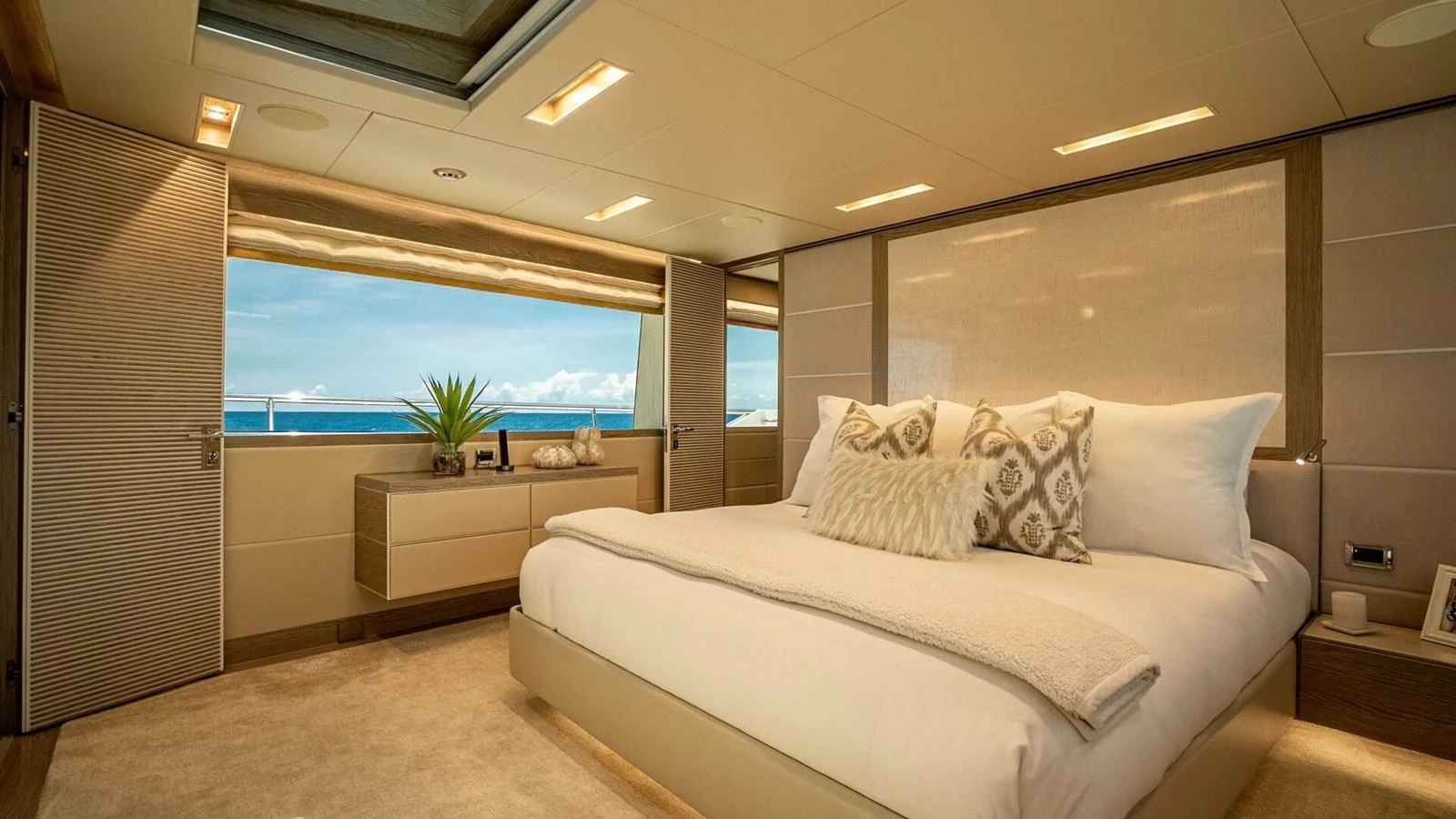 The master stateroom offers a luxurious and serene retreat with a large bed and stunning ocean views. aboard SHORT STORY Yacht for Sale