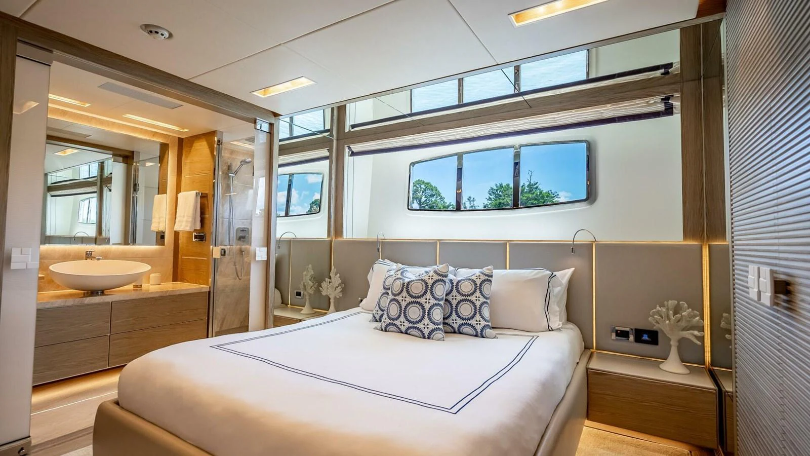 The master stateroom features a luxurious bed with elegant decor and an ensuite bathroom. aboard SHORT STORY Yacht for Sale