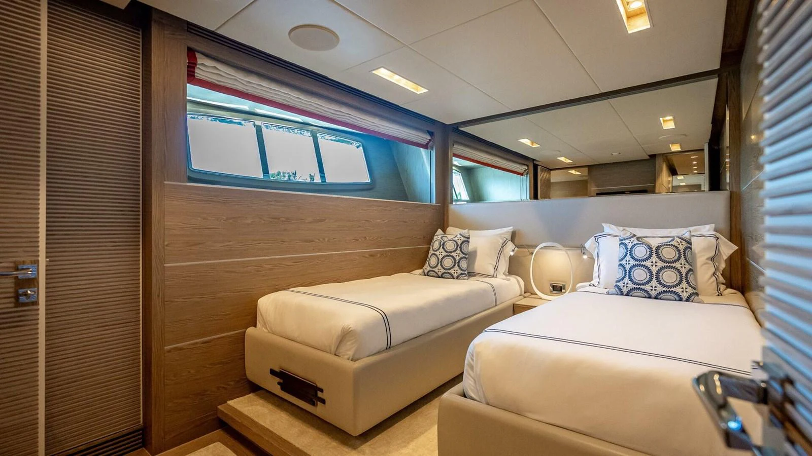 The guest stateroom offers a cozy and inviting space with twin beds and stylish decor. aboard SHORT STORY Yacht for Sale