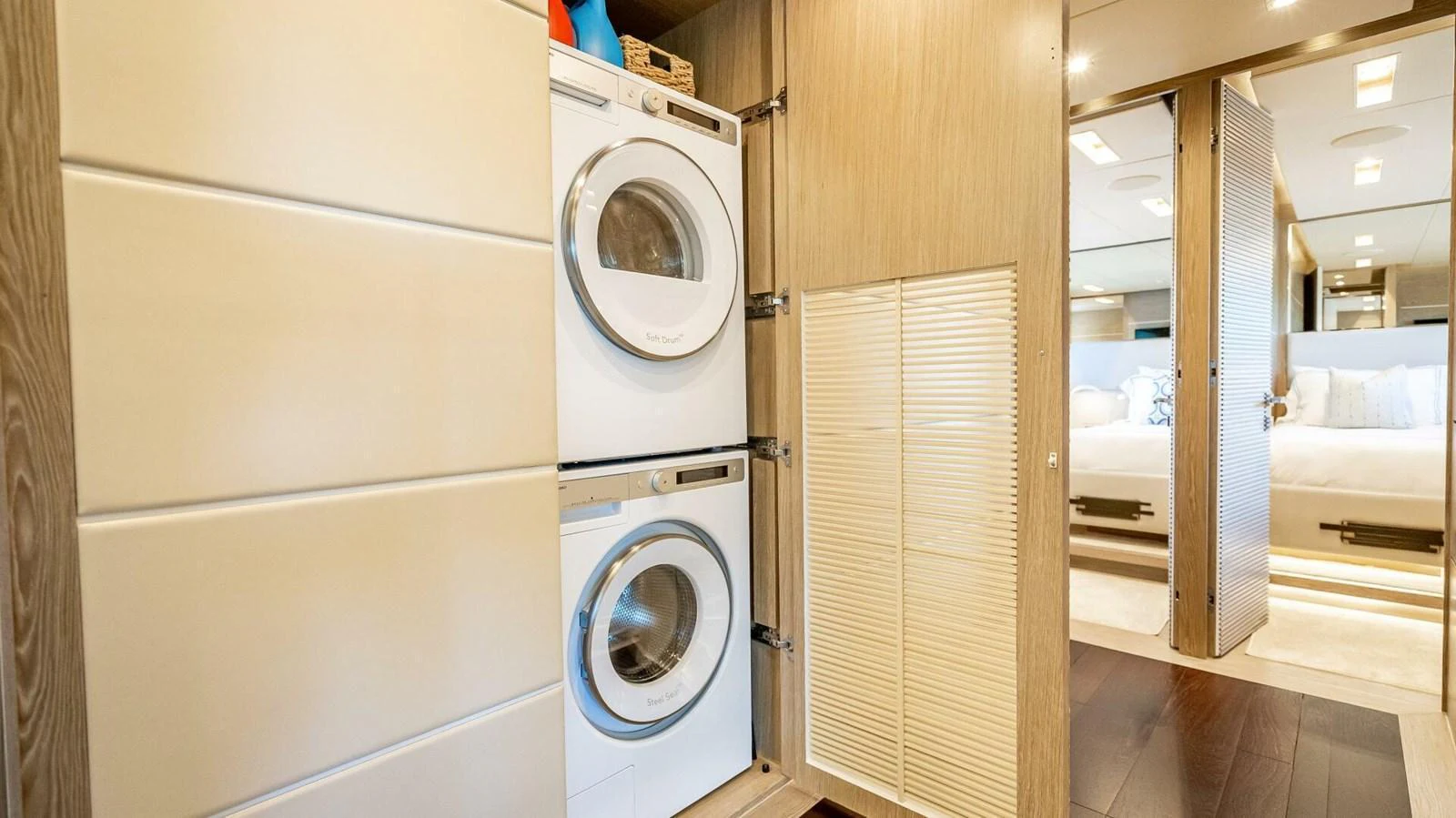 The yacht features a convenient and modern laundry area with stacked washer and dryer units. aboard SHORT STORY Yacht for Sale