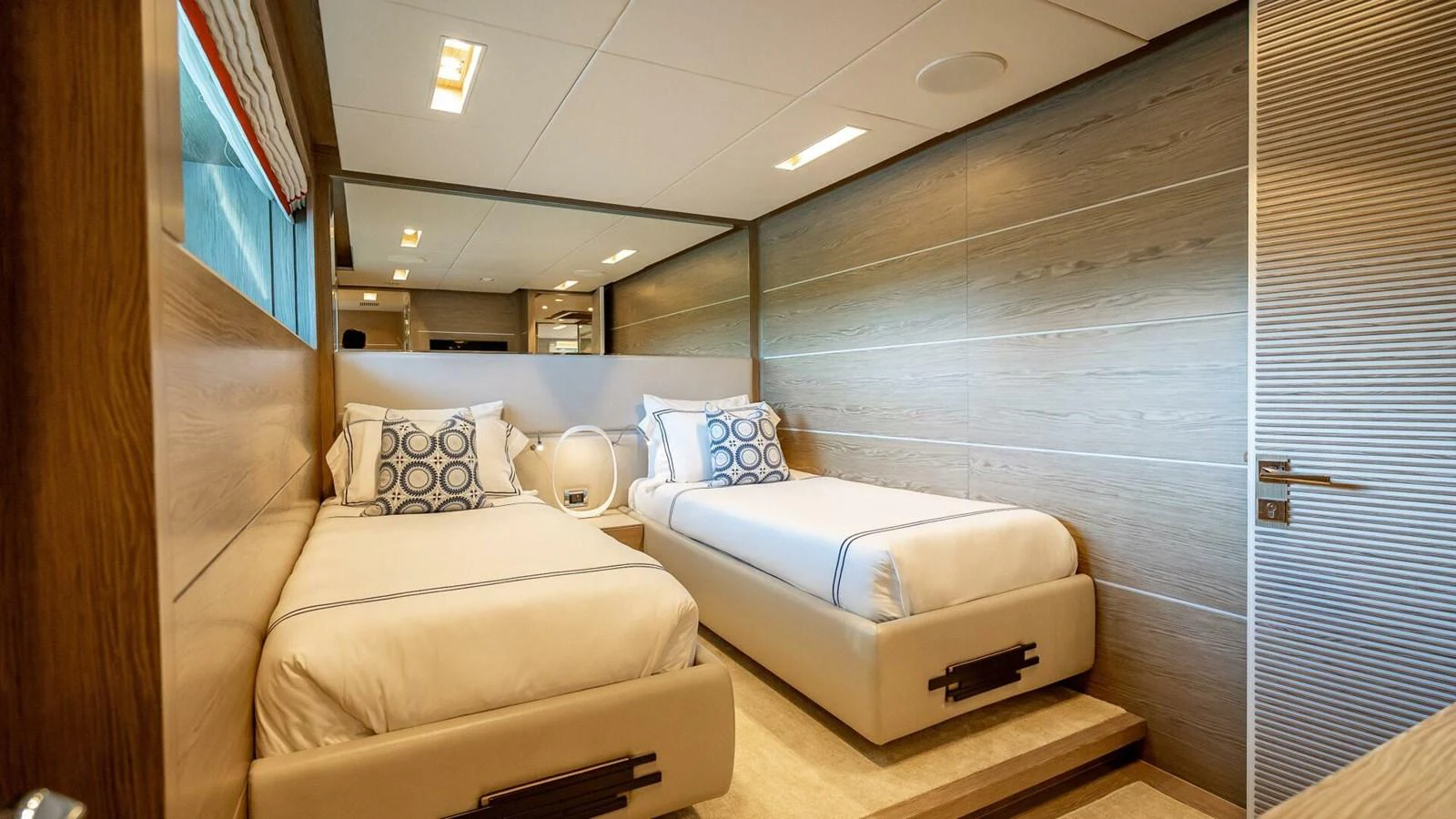 The twin stateroom offers a cozy and stylish retreat with modern furnishings and ample natural light. aboard SHORT STORY Yacht for Sale