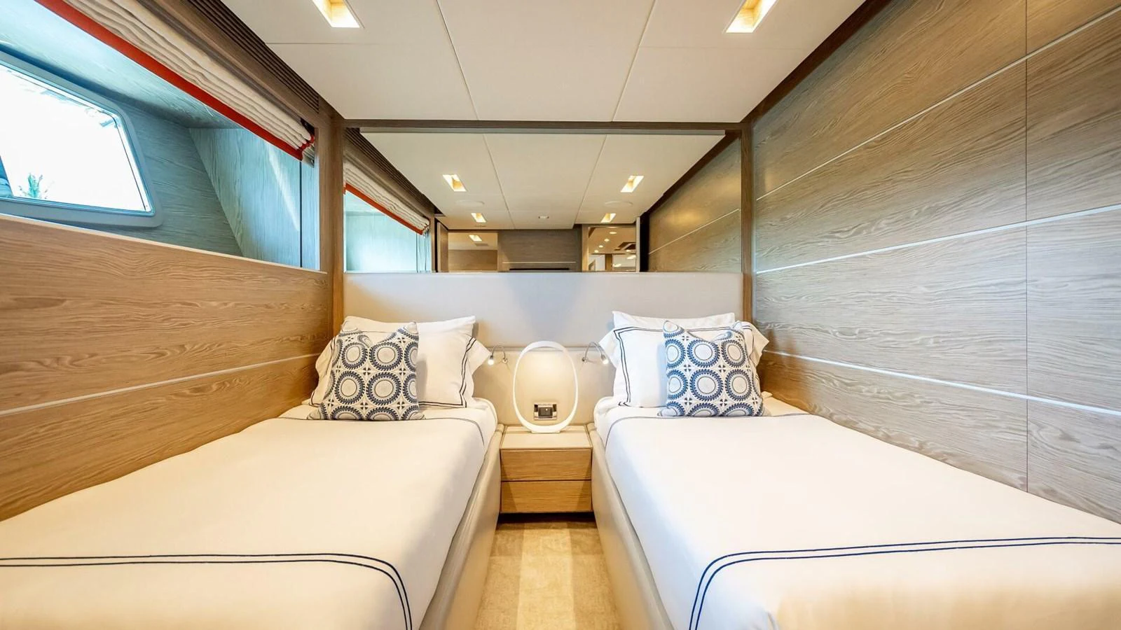 The twin stateroom offers a cozy and elegant sleeping area with modern decor and ample natural light. aboard SHORT STORY Yacht for Sale