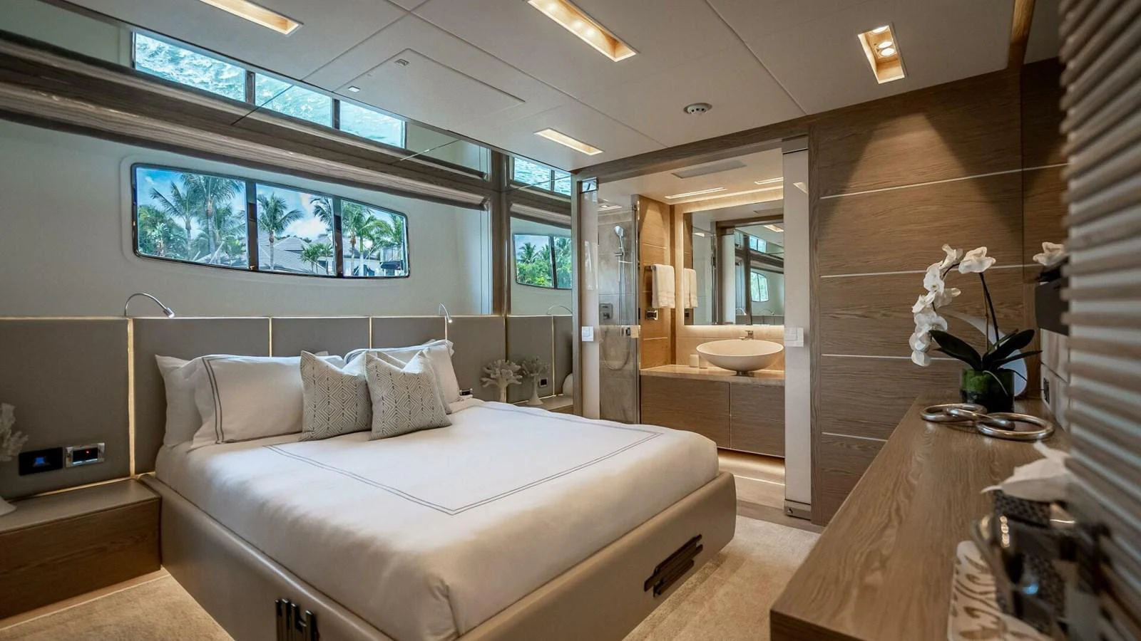 The master stateroom features a luxurious bed, elegant decor, and an en-suite bathroom with modern fixtures. aboard SHORT STORY Yacht for Sale