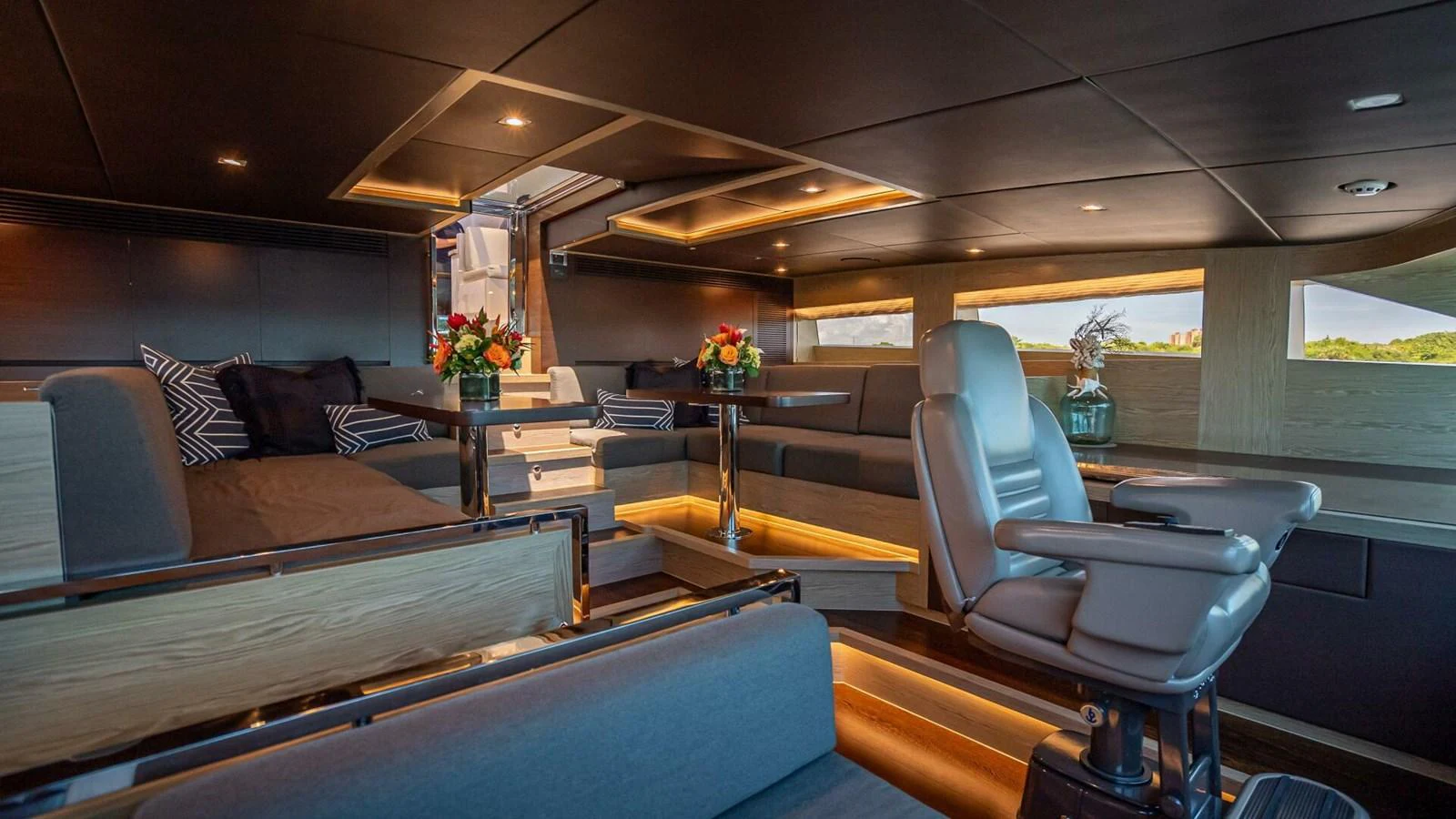 The salon features luxurious seating, ambient lighting, and elegant decor, creating a sophisticated and comfortable atmosphere. aboard SHORT STORY Yacht for Sale