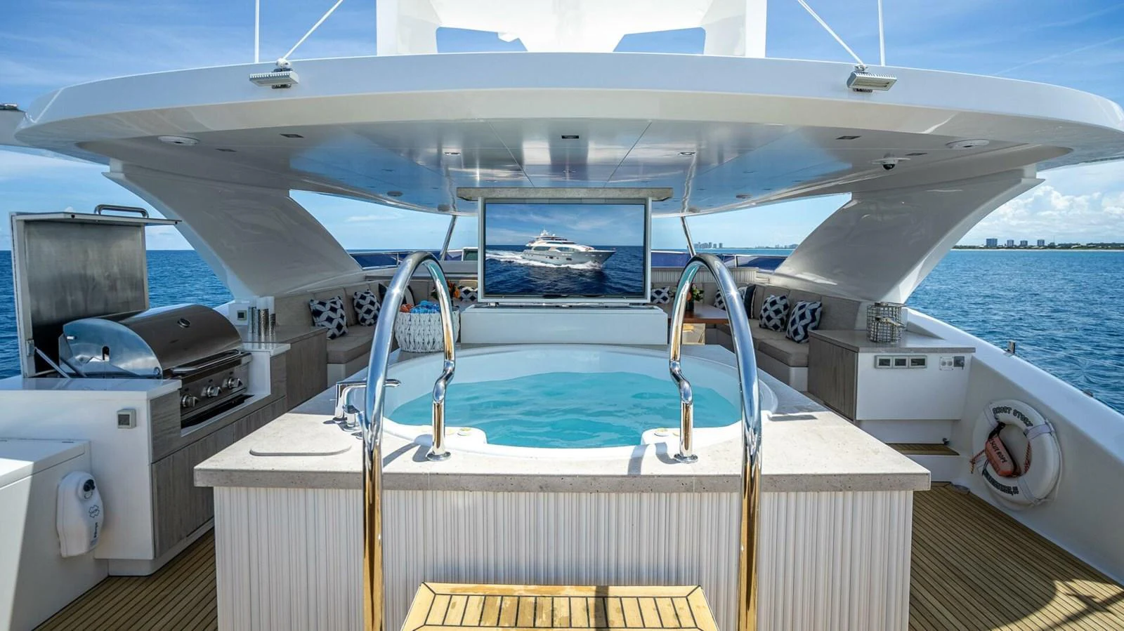 The sundeck features a luxurious jacuzzi with a view of the open sea. aboard SHORT STORY Yacht for Sale