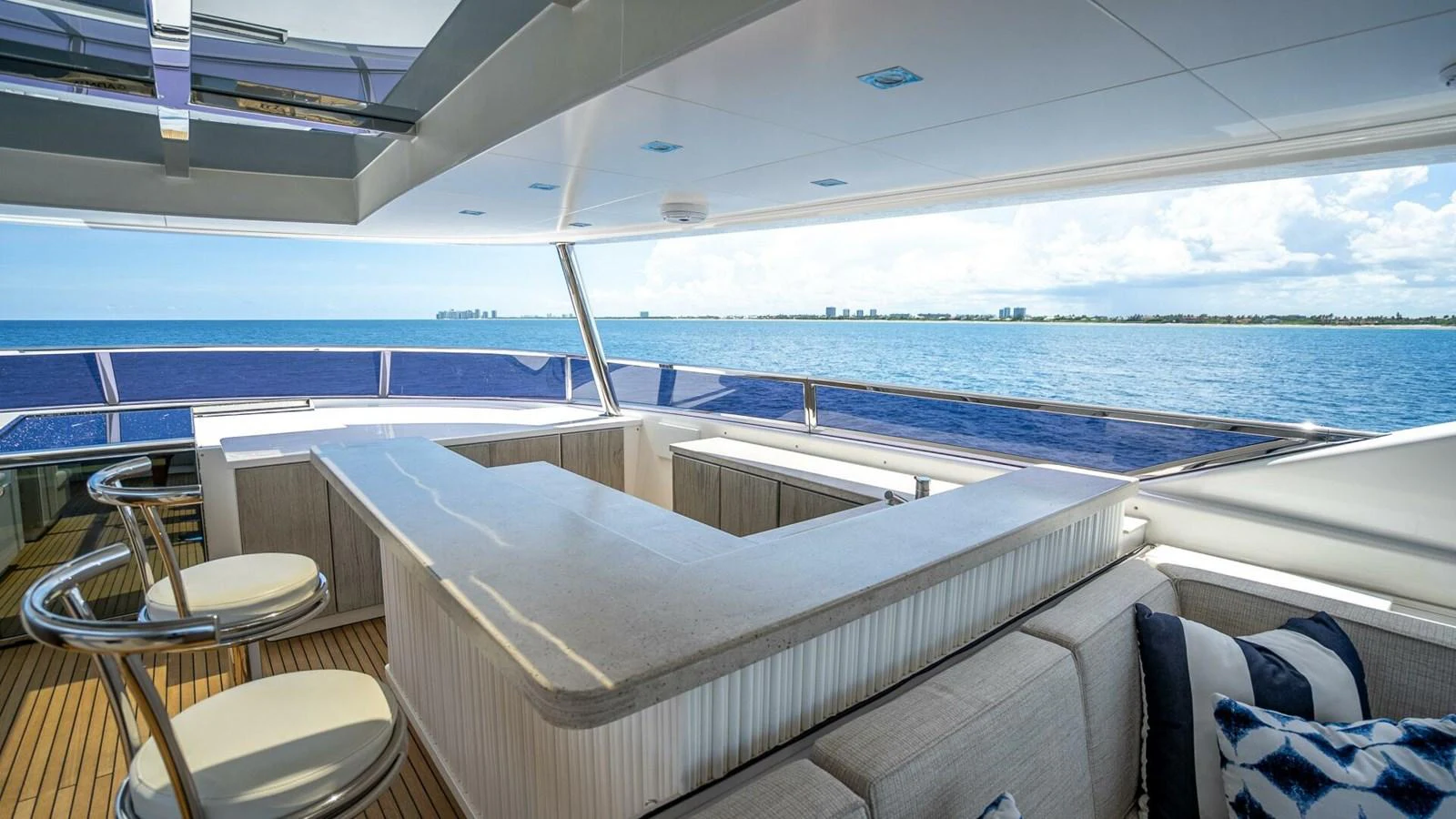 The flybridge offers a spacious and luxurious seating area with panoramic ocean views. aboard SHORT STORY Yacht for Sale