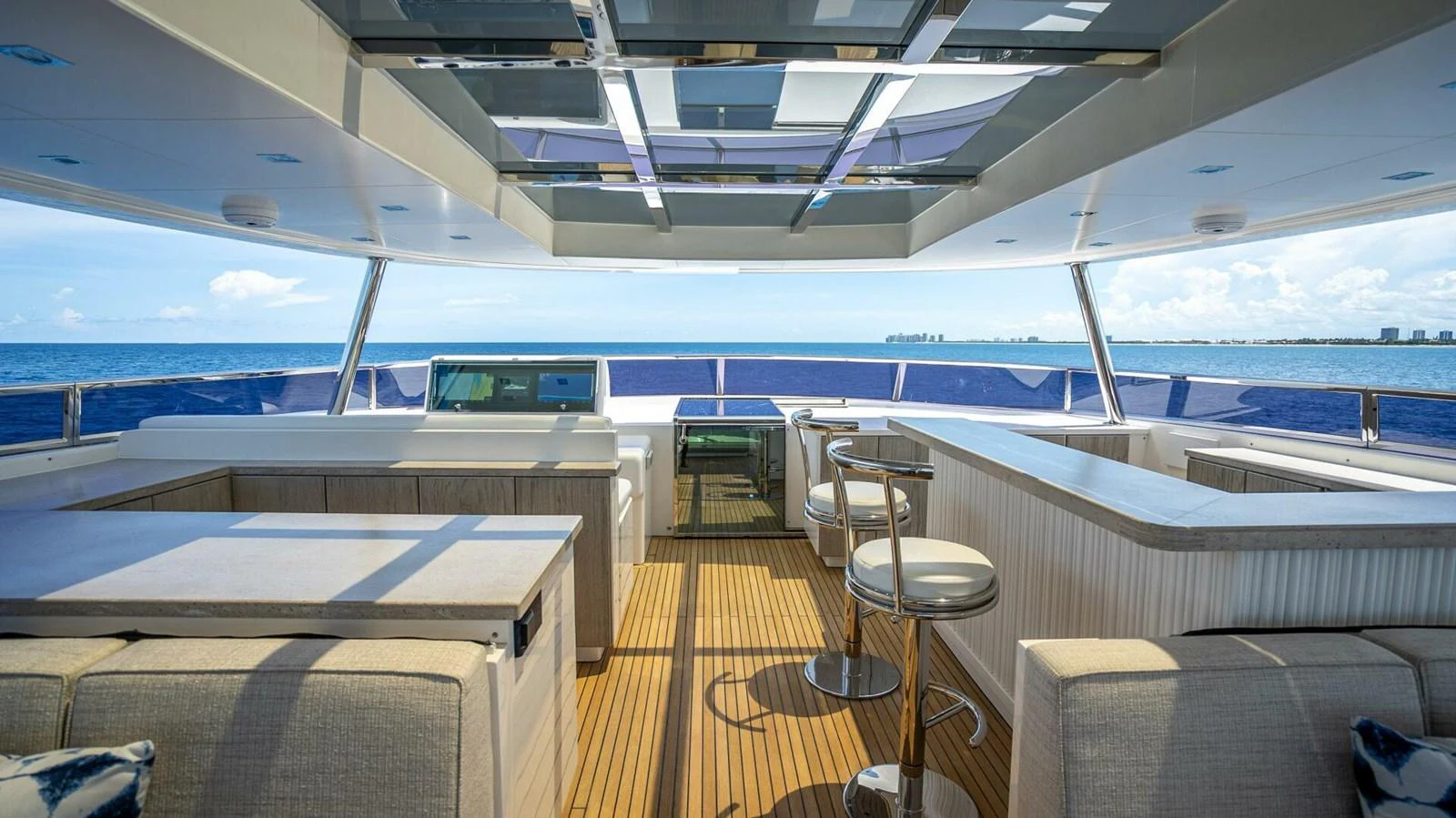 The flybridge offers a spacious and luxurious area with ample seating and stunning ocean views. aboard SHORT STORY Yacht for Sale