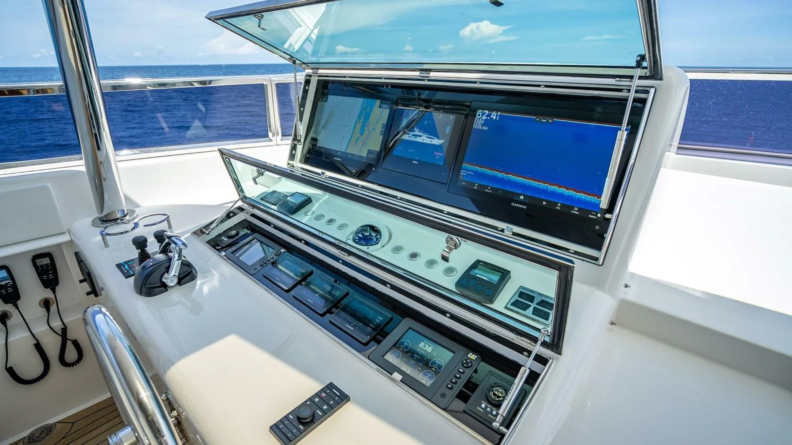 The helm station features advanced navigation and control systems with a stunning ocean view. aboard SHORT STORY Yacht for Sale