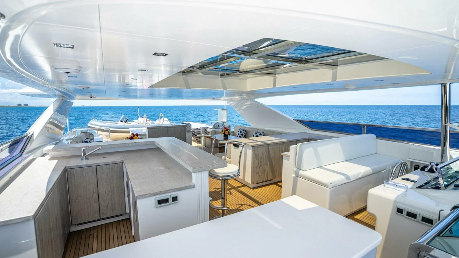 The flybridge offers a spacious and luxurious area with ample seating and stunning ocean views. aboard SHORT STORY Yacht for Sale