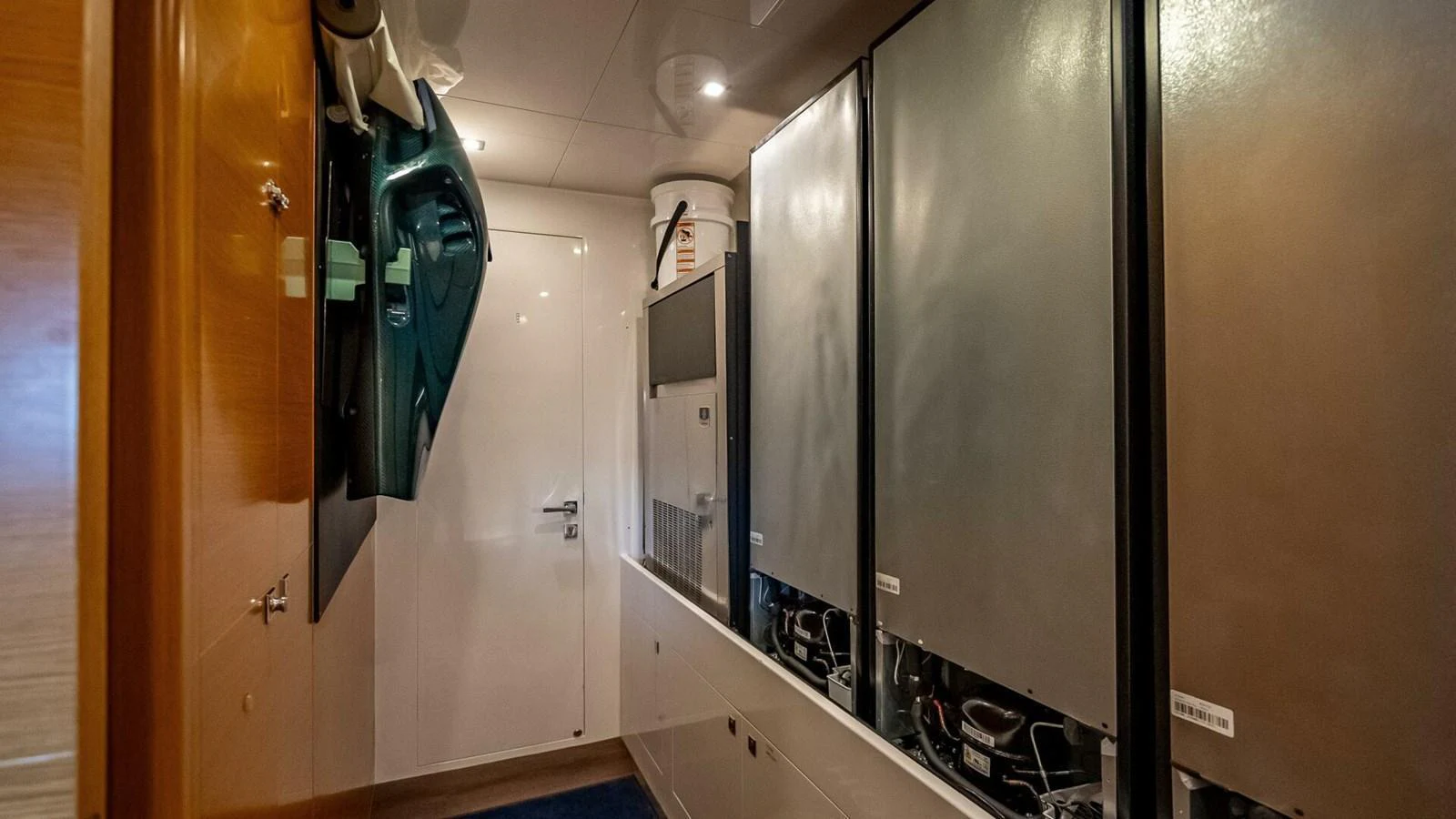 The image showcases the yacht's engine room with neatly arranged equipment and machinery. aboard SHORT STORY Yacht for Sale