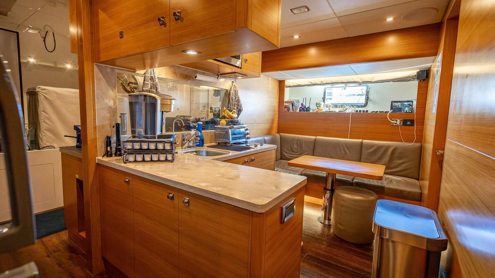 The yacht's galley features modern appliances, ample counter space, and a cozy dining area. aboard SHORT STORY Yacht for Sale