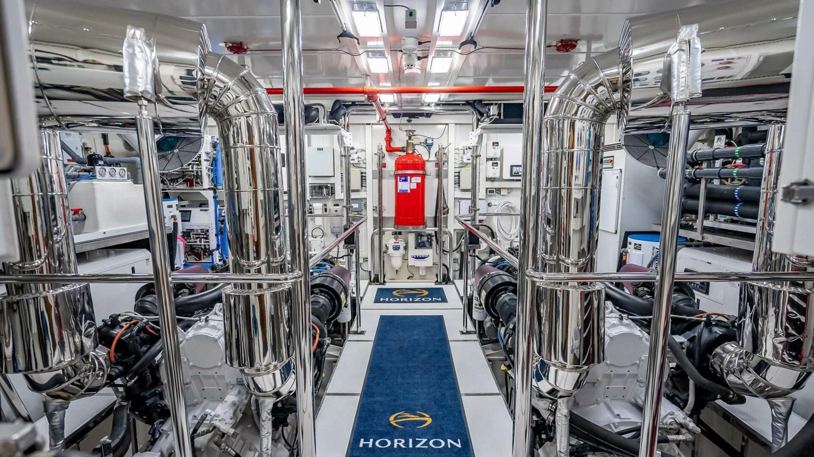 The engine room showcases advanced machinery and pristine organization, reflecting the yacht's high standards of maintenance. aboard SHORT STORY Yacht for Sale