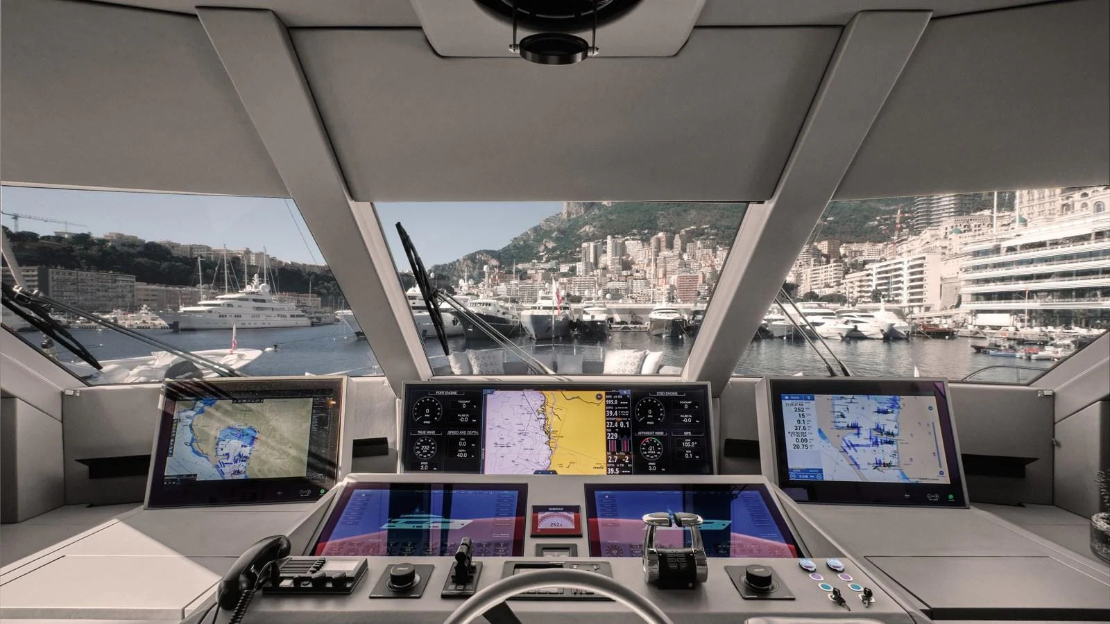 The helm station offers advanced navigation technology with a panoramic view of the marina. aboard BIZMAN Yacht for Sale