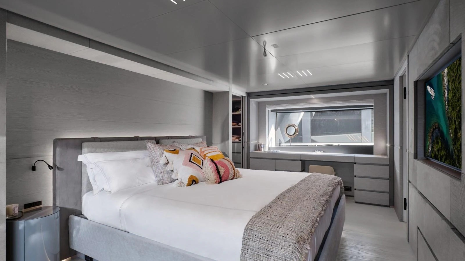A luxurious stateroom featuring a large bed, modern decor, and ample natural light. aboard BIZMAN Yacht for Sale