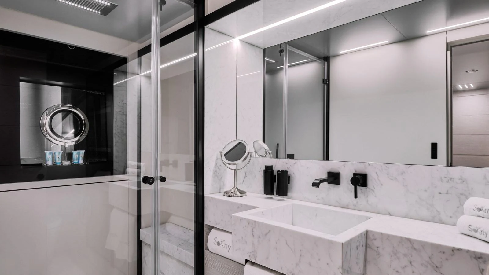 The yacht's bathroom features modern fixtures and a sleek, minimalist design with marble accents. aboard BIZMAN Yacht for Sale