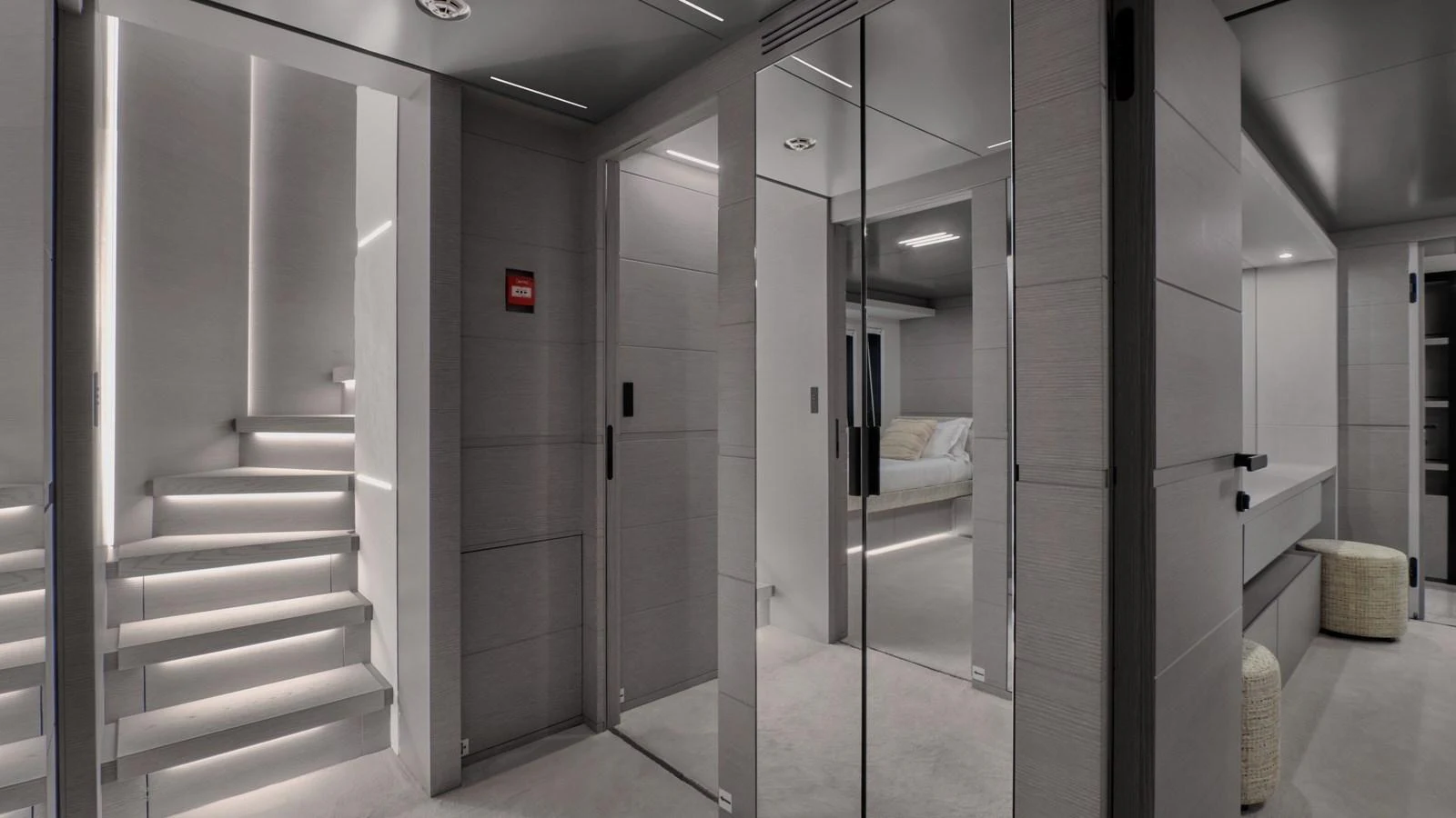 The modern interior features sleek lines, mirrored walls, and ambient lighting. aboard BIZMAN Yacht for Sale