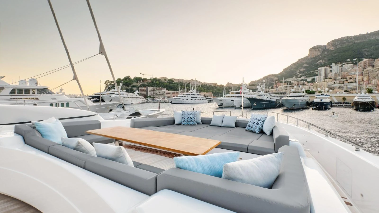 The sundeck offers a spacious and inviting lounging area with plush seating and scenic views. aboard BIZMAN Yacht for Sale