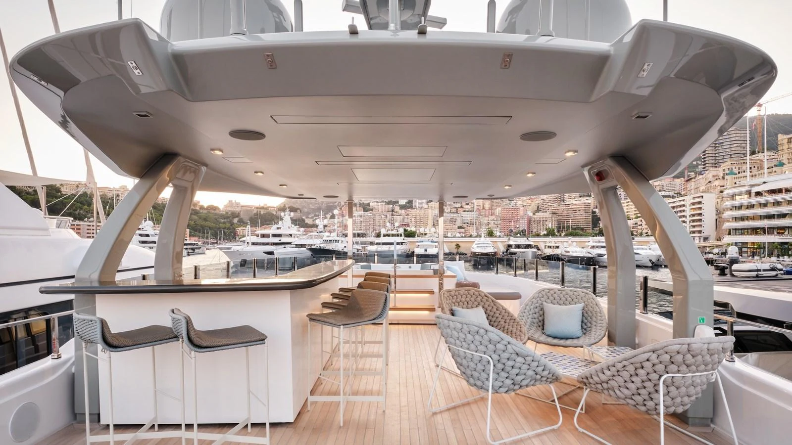 The flybridge offers a luxurious open-air bar and seating area with stunning marina views. aboard BIZMAN Yacht for Sale