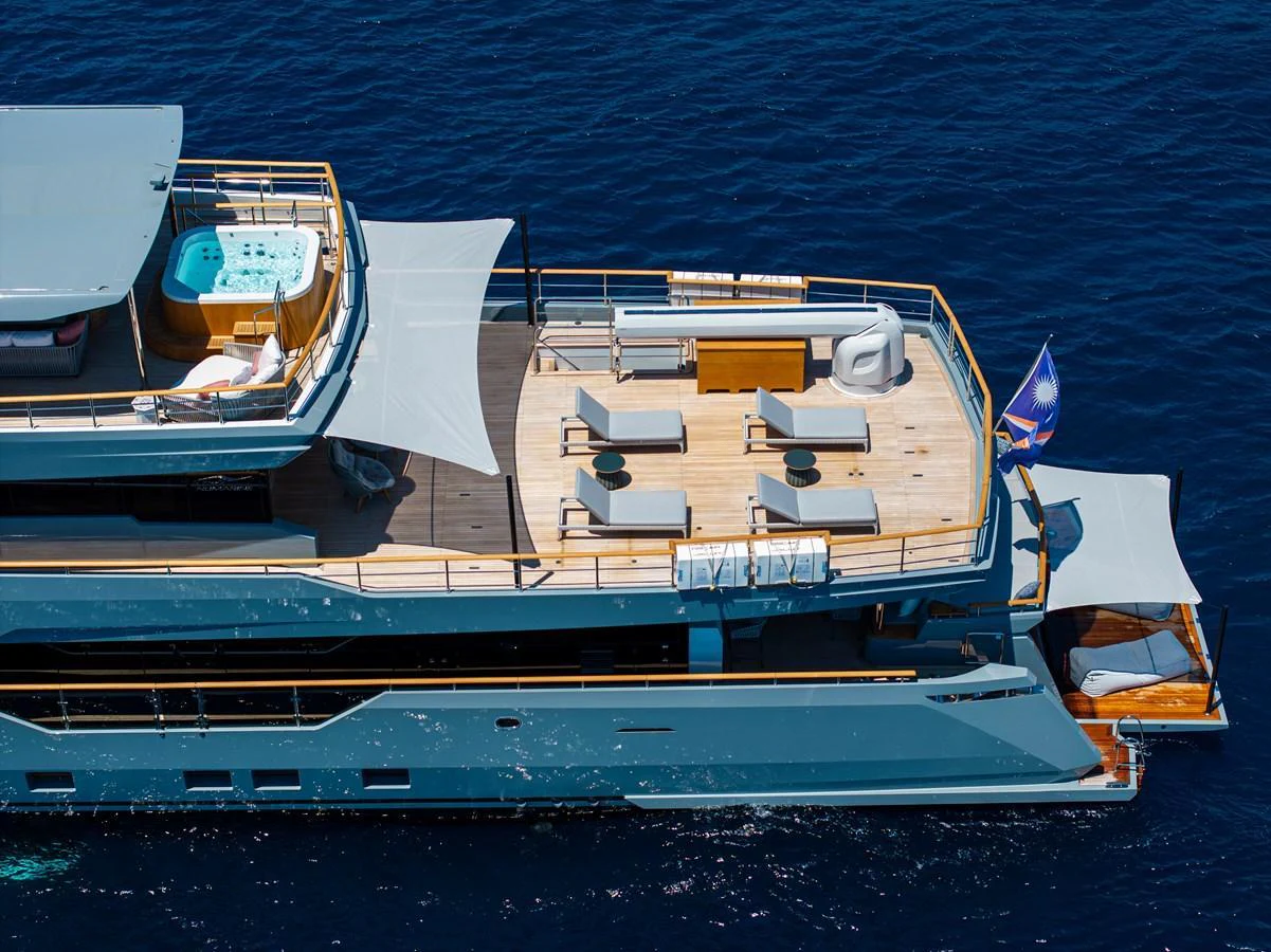 The yacht's sundeck features a luxurious hot tub and ample lounging space, perfect for relaxation. aboard OSCAR Yacht for Sale
