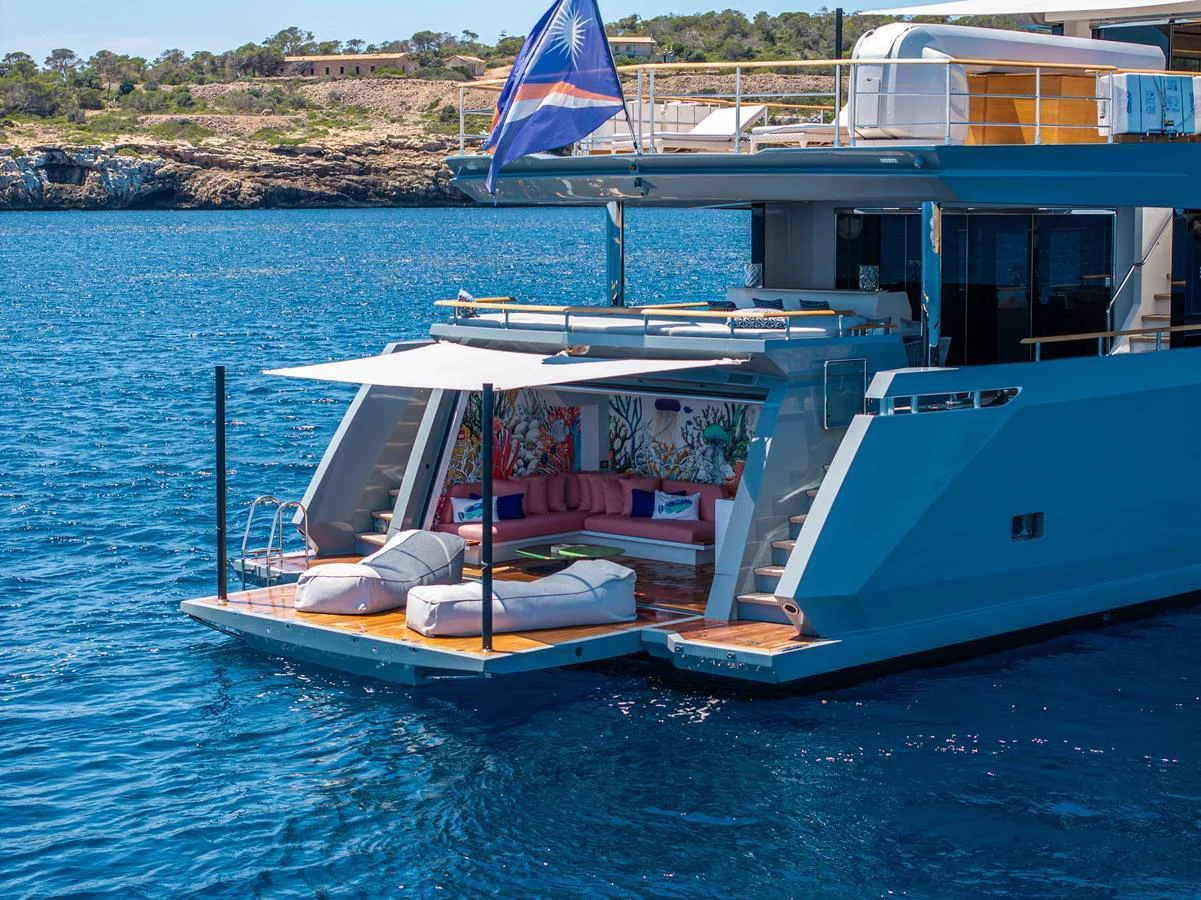The yacht's aft deck features a luxurious lounging area with direct access to the water, perfect for relaxation and entertainment. aboard OSCAR Yacht for Sale