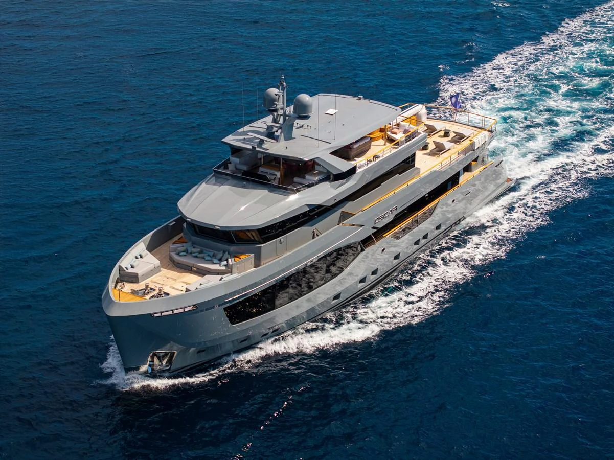 A luxurious yacht cruises through the open sea, showcasing its sleek design and spacious decks. aboard OSCAR Yacht for Sale