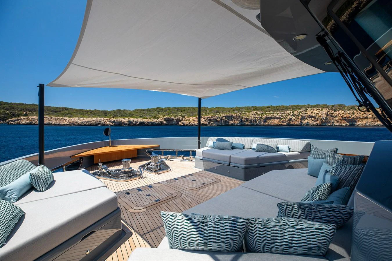 The sundeck offers a luxurious lounging area with plush seating and a stunning view of the coastline. aboard OSCAR Yacht for Sale