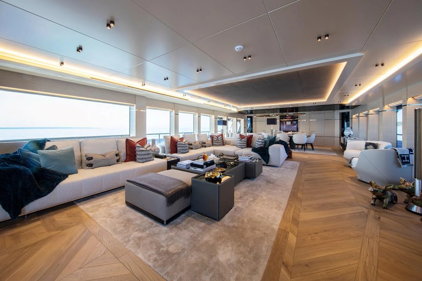 The spacious salon features luxurious seating and modern decor, offering a comfortable and elegant space for relaxation. aboard OSCAR Yacht for Sale