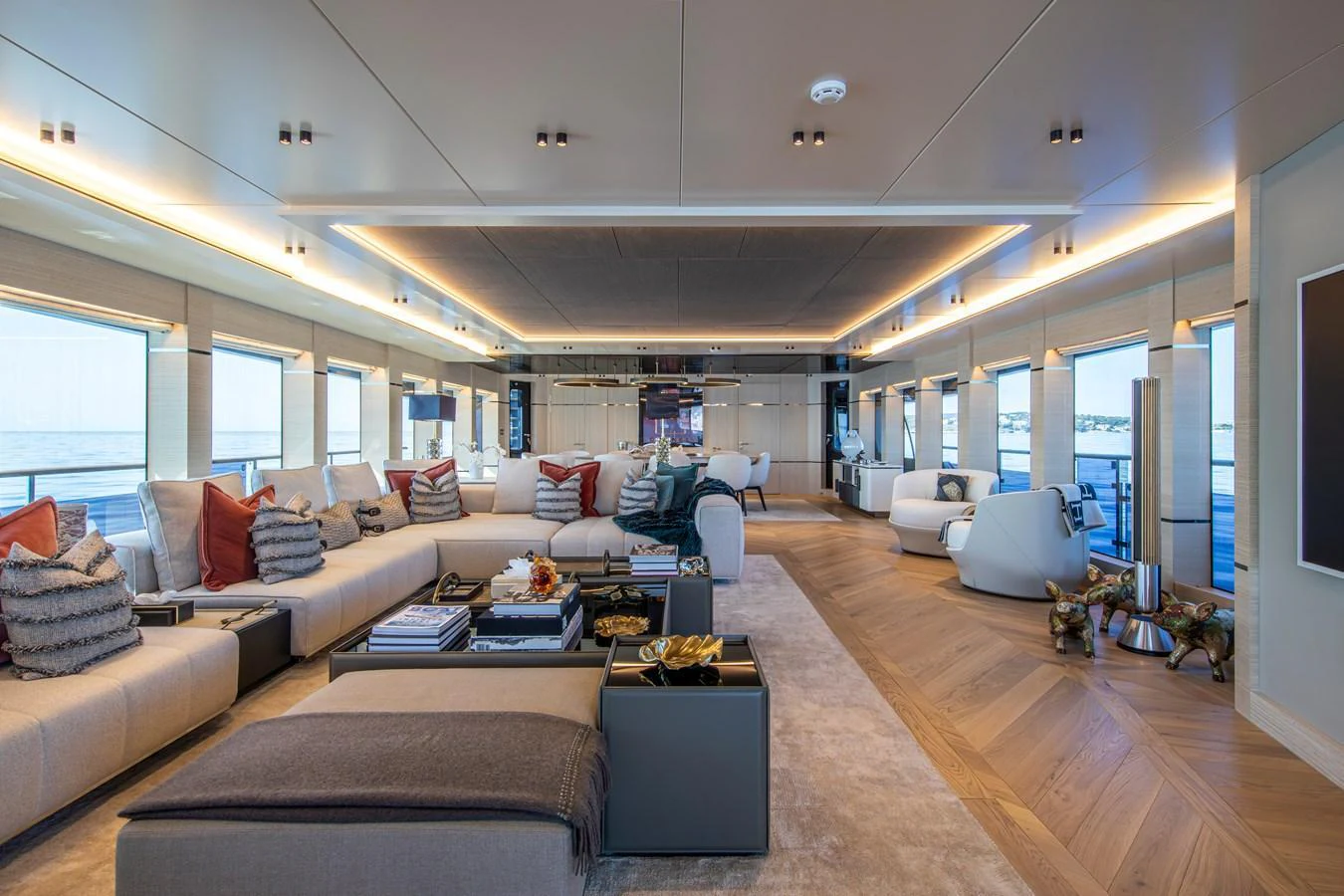 The spacious salon features luxurious seating and panoramic windows, creating an inviting and elegant atmosphere. aboard OSCAR Yacht for Sale