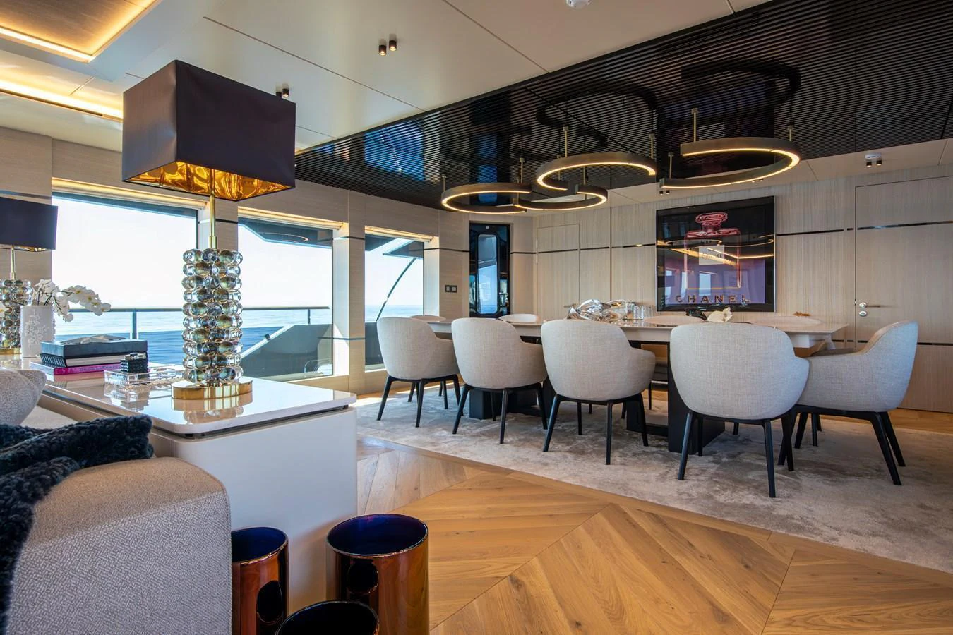 The yacht's dining area features modern furnishings and elegant lighting, creating a luxurious atmosphere. aboard OSCAR Yacht for Sale