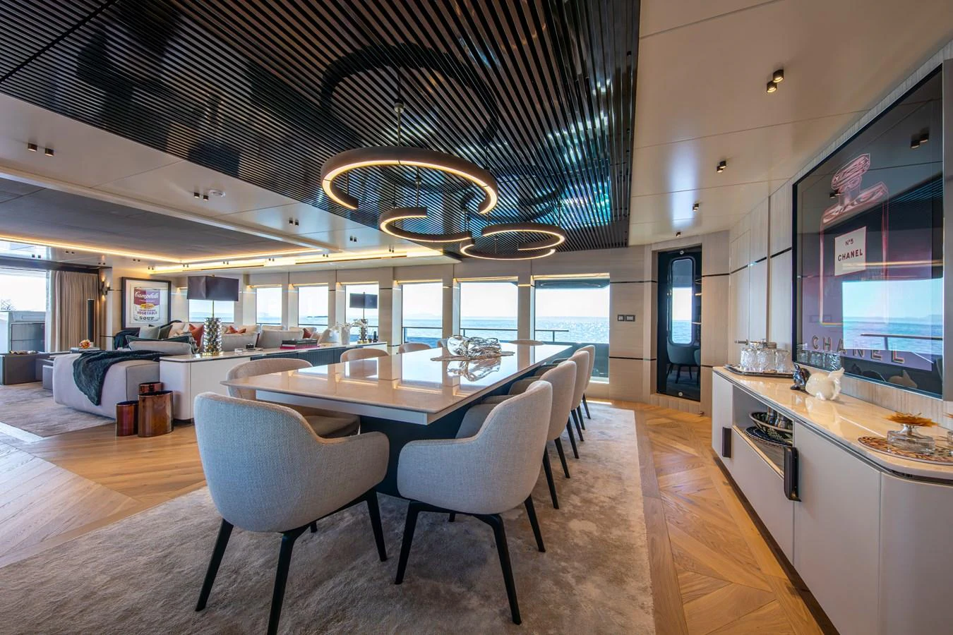 The yacht's dining area features a modern design with elegant furnishings and ample natural light. aboard OSCAR Yacht for Sale