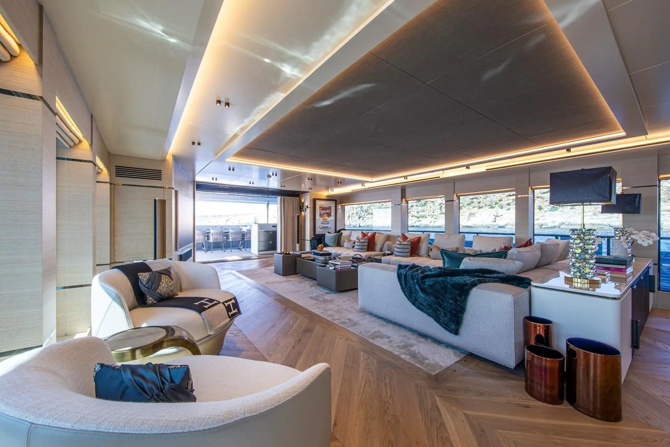 The spacious salon features modern furnishings and ample natural light, creating a luxurious and inviting atmosphere. aboard OSCAR Yacht for Sale