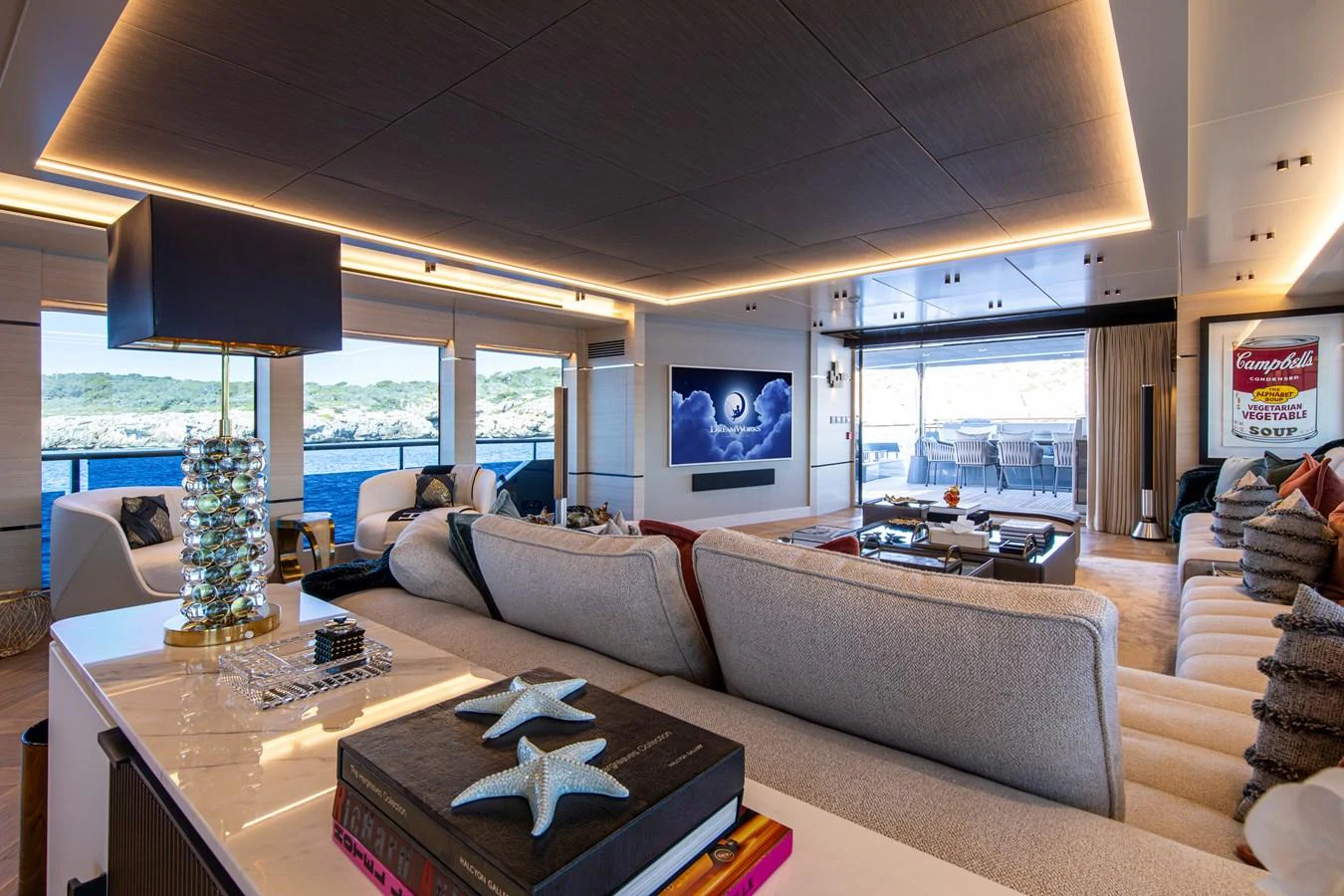 The spacious salon offers luxurious seating and panoramic views, perfect for relaxation and entertainment. aboard OSCAR Yacht for Sale