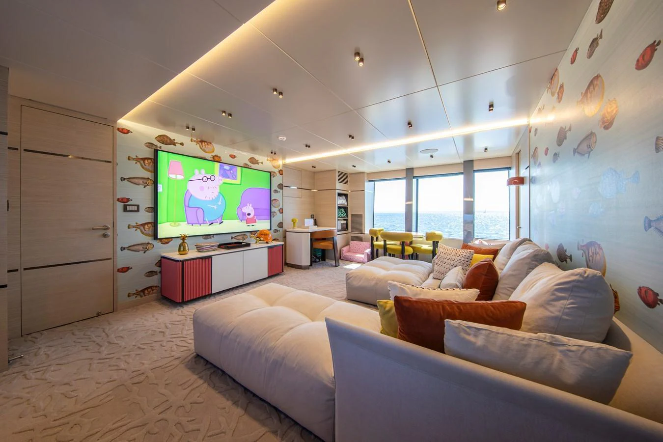 A cozy lounge area with a large screen TV and comfortable seating, perfect for relaxation and entertainment. aboard OSCAR Yacht for Sale