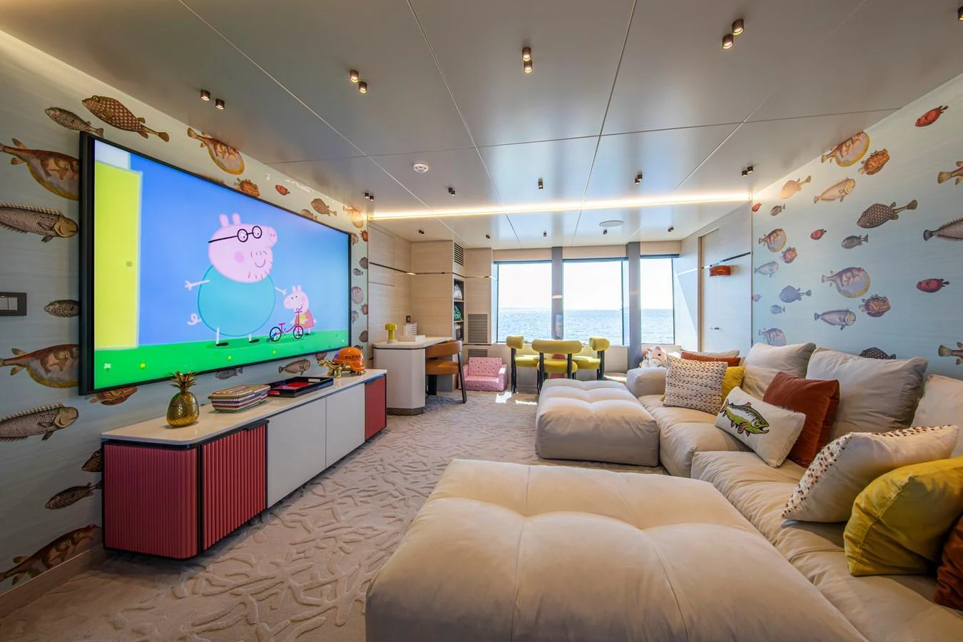 A cozy lounge area with a large TV and comfortable seating, perfect for relaxation and entertainment. aboard OSCAR Yacht for Sale