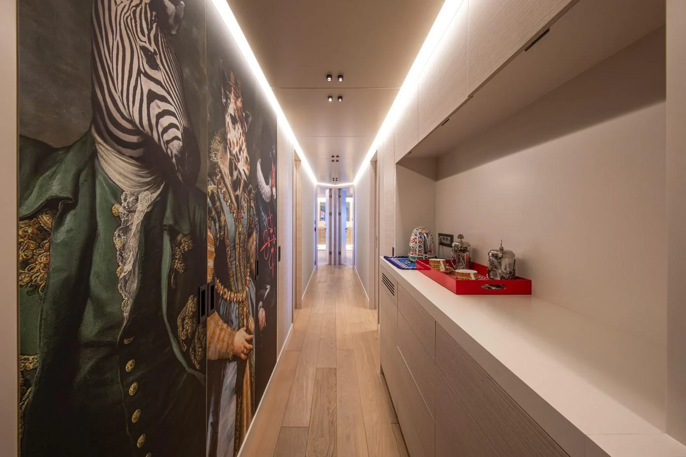 A stylish hallway with unique zebra-themed artwork and modern decor. aboard OSCAR Yacht for Sale