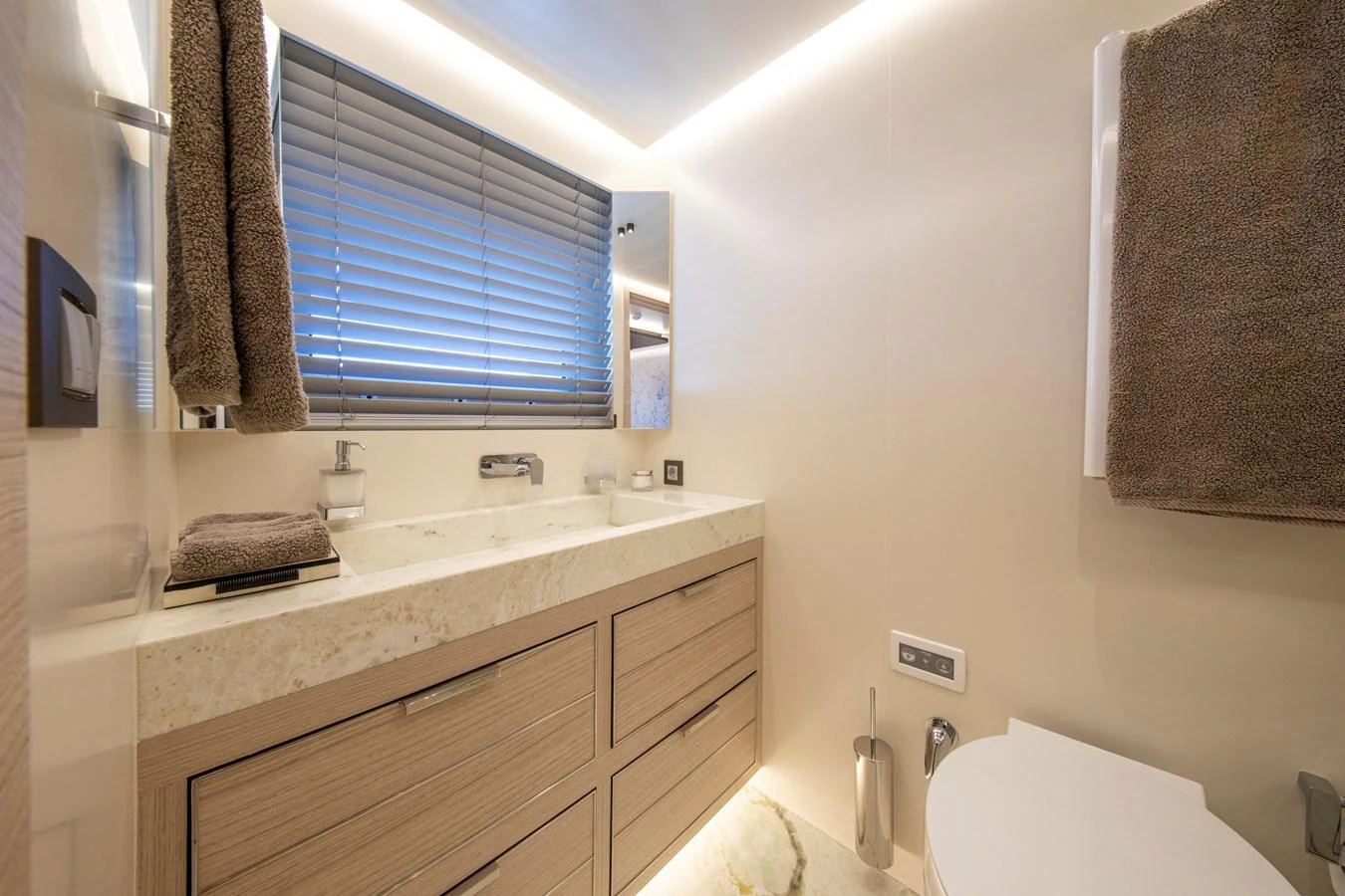 The yacht's bathroom features modern fixtures and a sleek design with ample natural light. aboard OSCAR Yacht for Sale