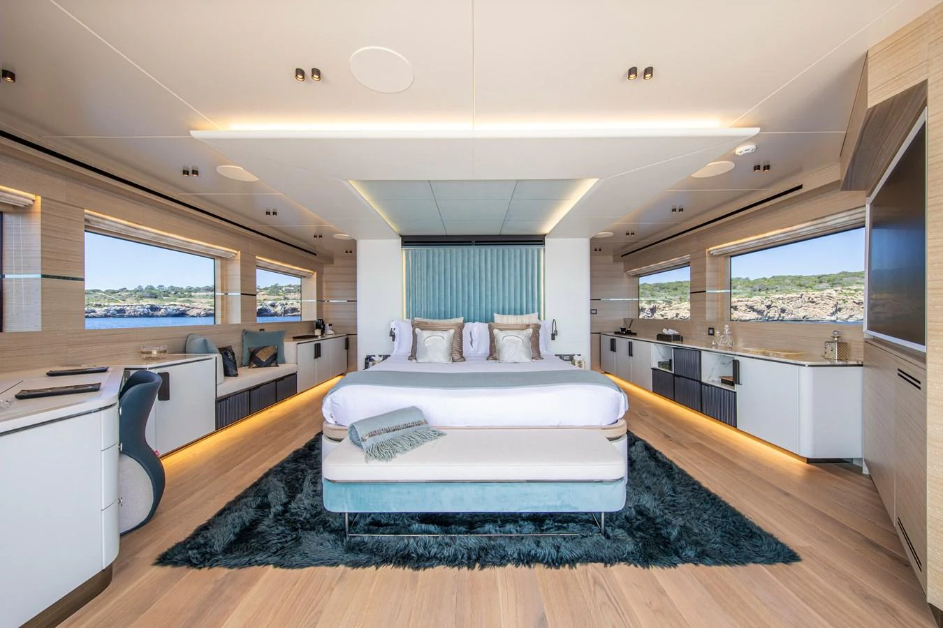 The master stateroom features a spacious and luxurious design with panoramic windows offering stunning views. aboard OSCAR Yacht for Sale