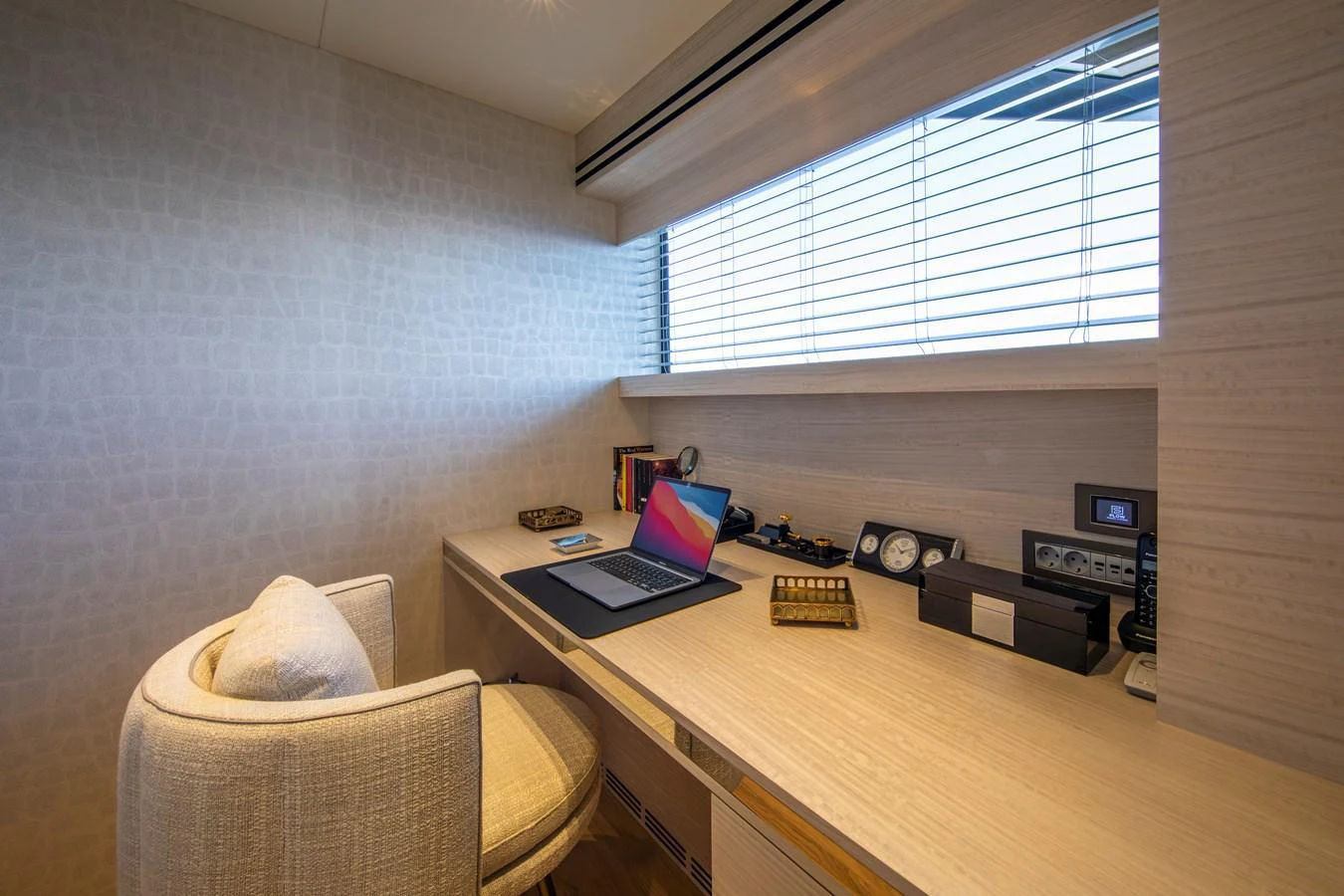A sleek and modern office space with a large desk and comfortable seating. aboard OSCAR Yacht for Sale