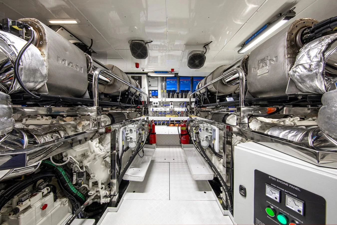 The engine room showcases powerful machinery and a clean, organized layout. aboard OSCAR Yacht for Sale