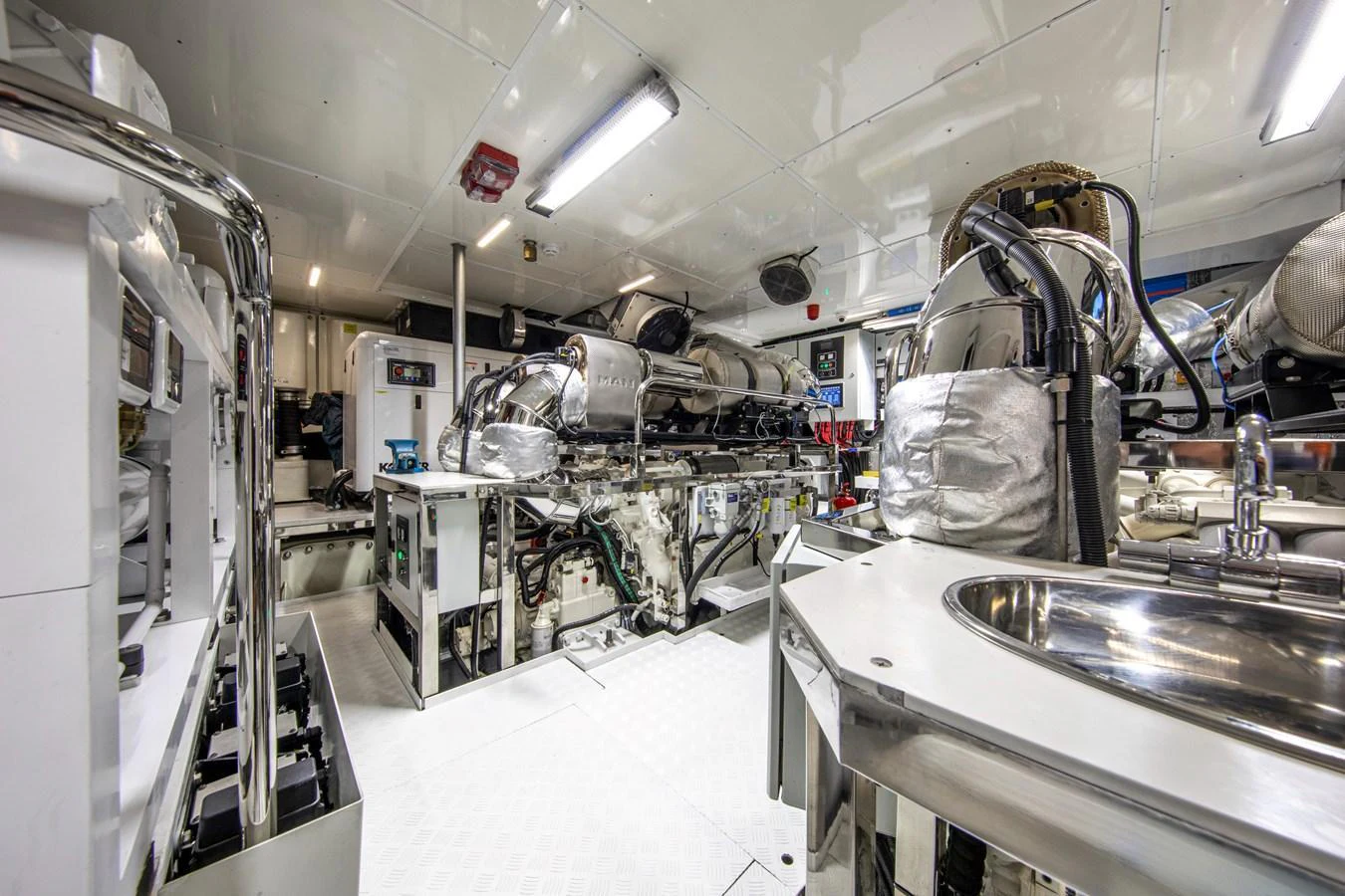 The image showcases the yacht's well-maintained engine room with advanced machinery and equipment. aboard OSCAR Yacht for Sale