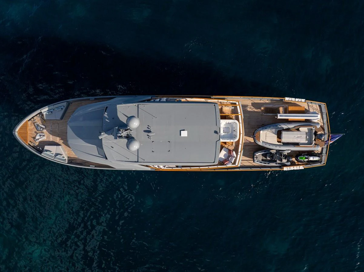 An aerial view of a luxurious yacht showcasing its sleek design and spacious deck areas. aboard OSCAR Yacht for Sale